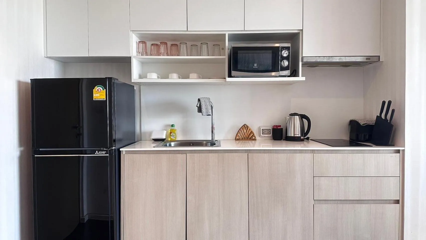 Kitchen or kitchenette in Veranda Residence pattaya By Sea