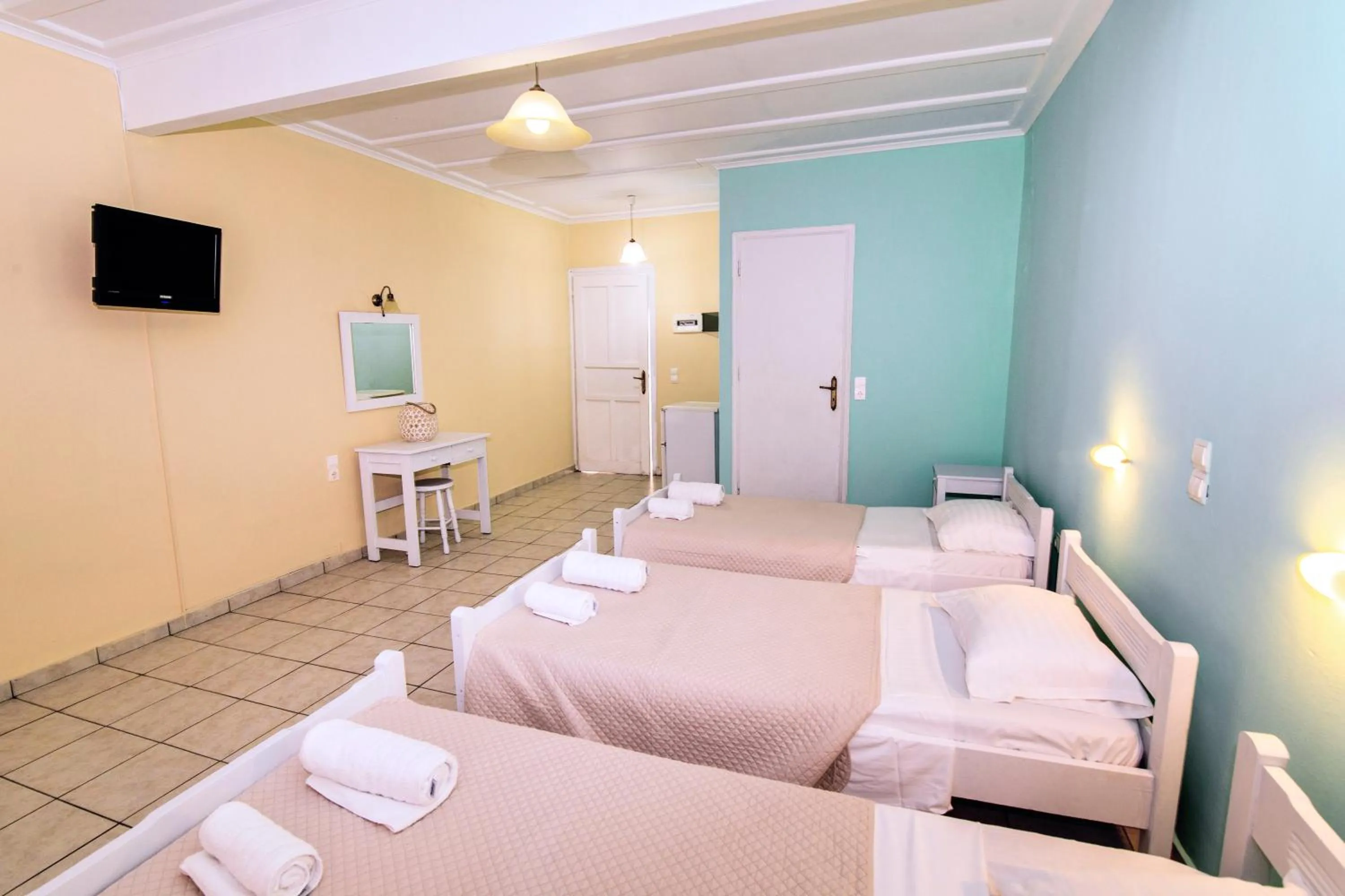 Bed in Blue Palm Hotel