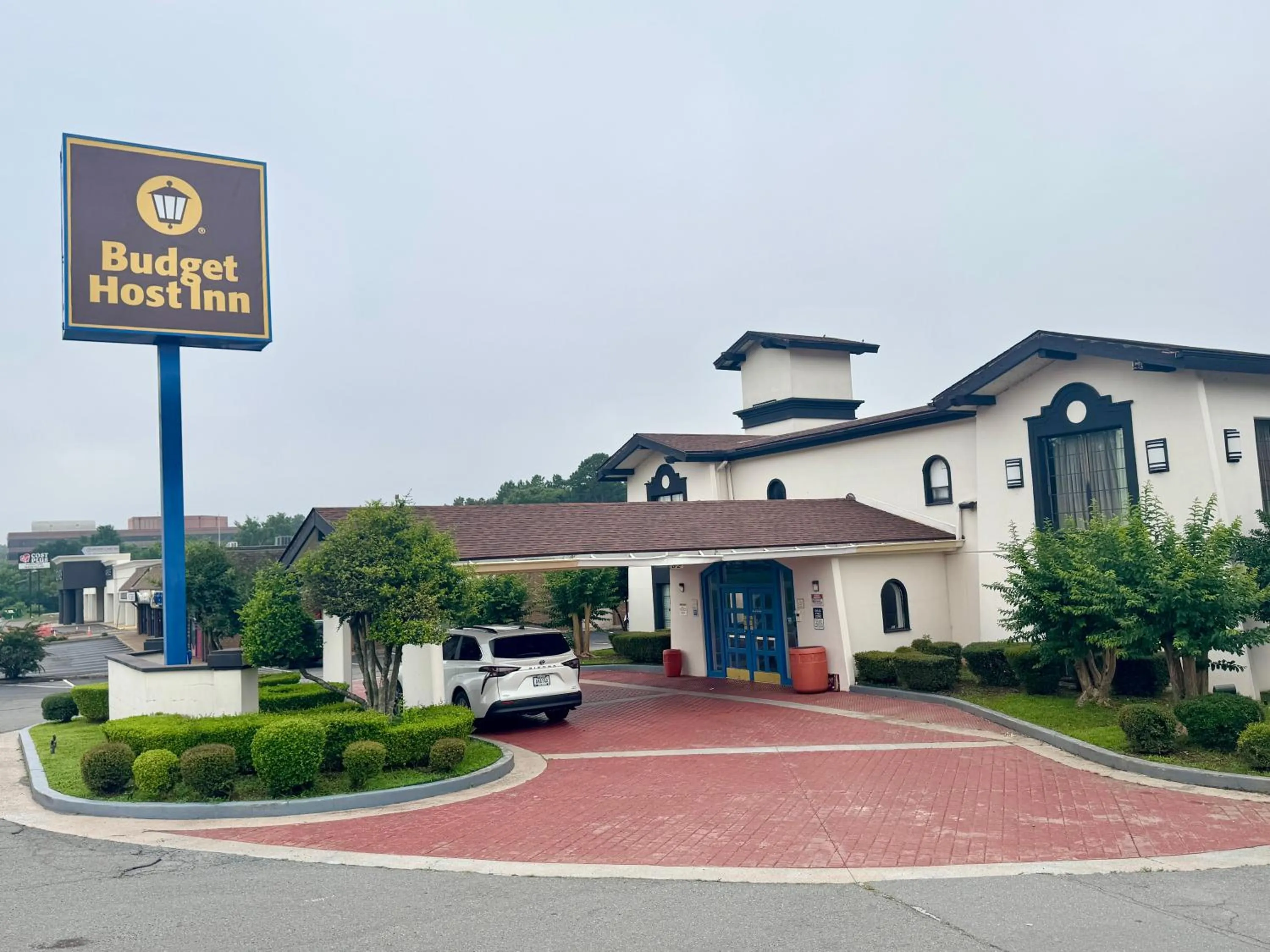 Property logo or sign in Budget Host Inn- Medical Center