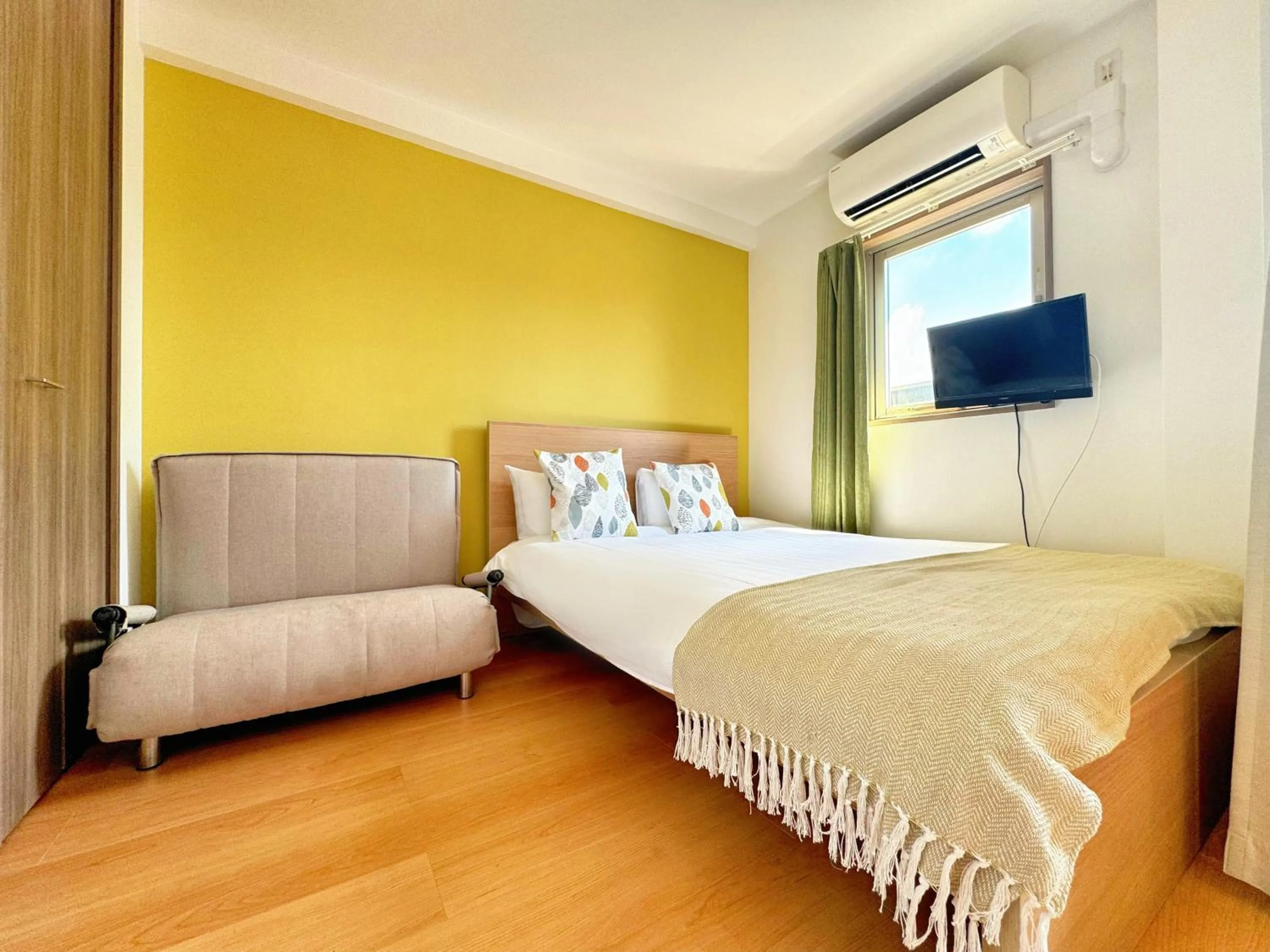 Bed in Juso AFP Apartment Hotel