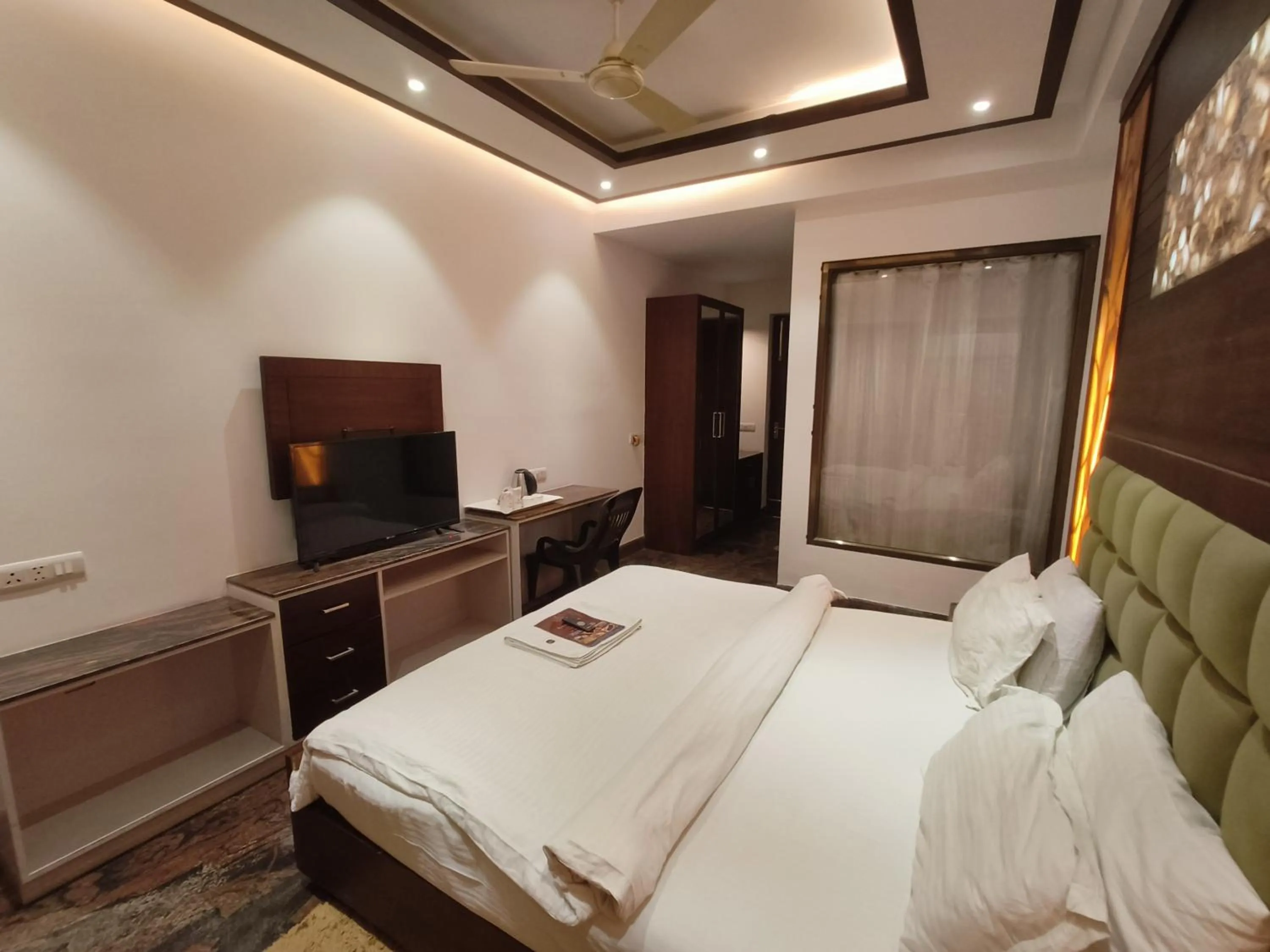 Bed in JJK Rukmini Vilas Hotel & Banquet