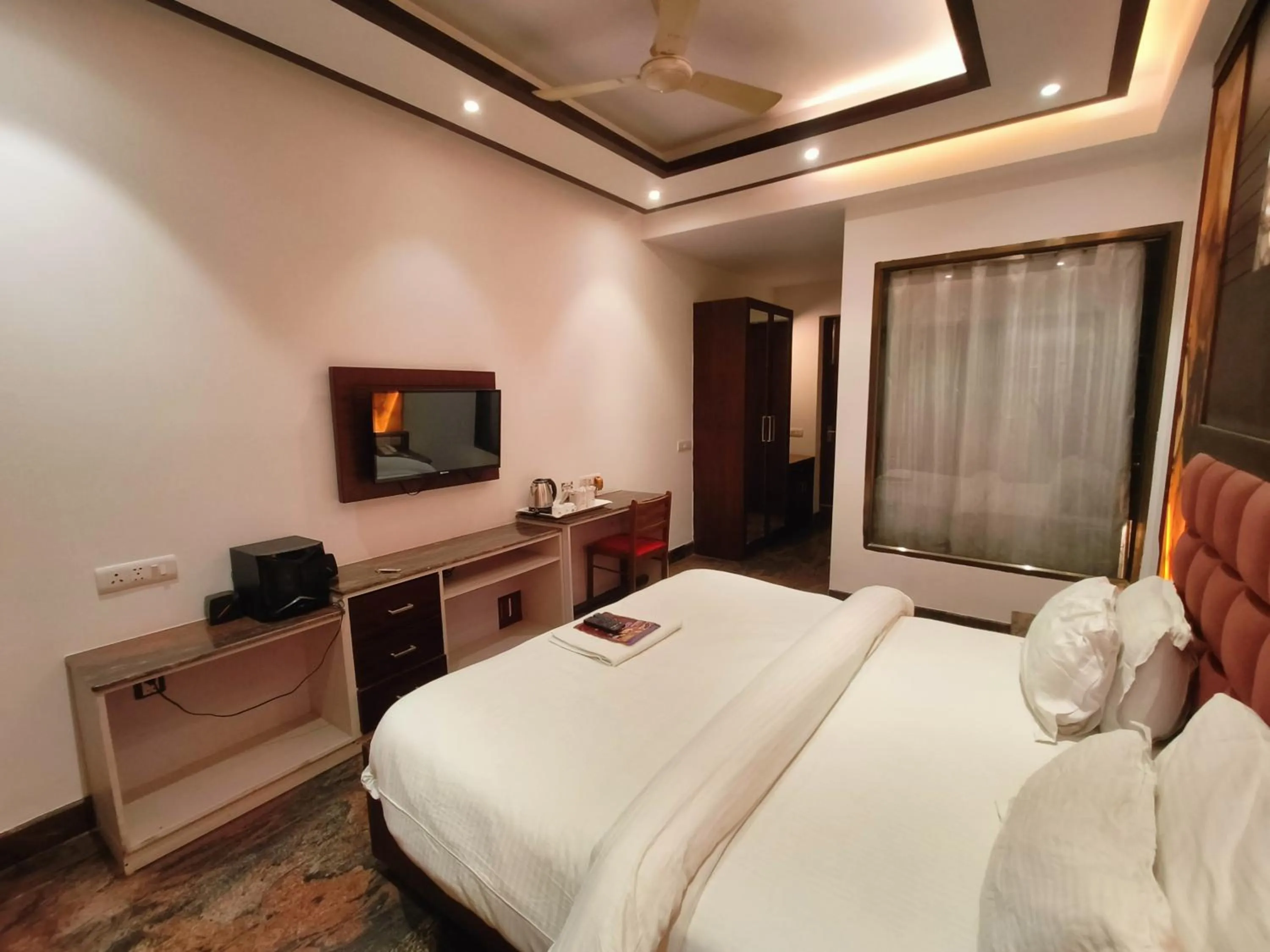 Bed in JJK Rukmini Vilas Hotel & Banquet
