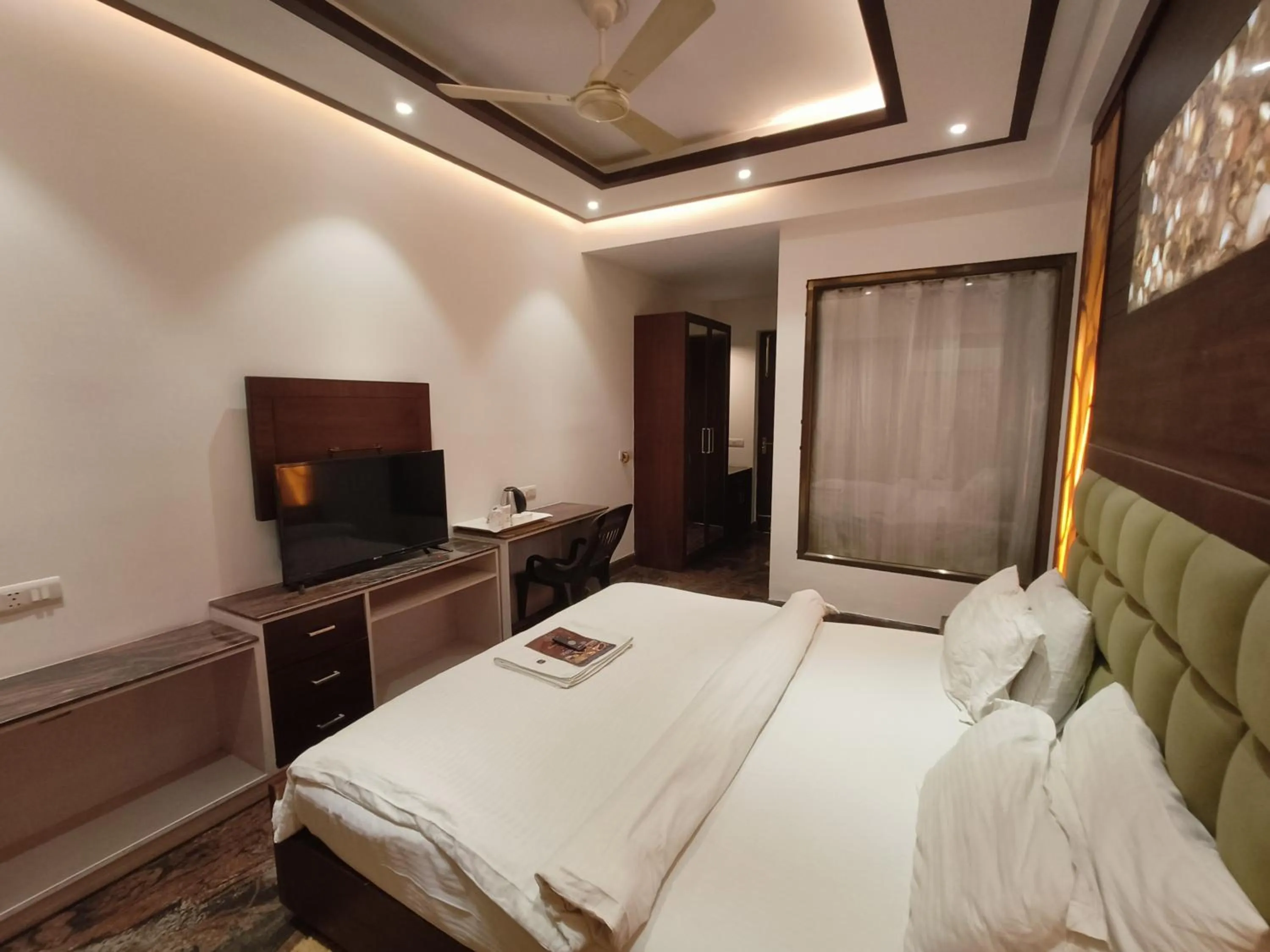 Bed in JJK Rukmini Vilas Hotel & Banquet
