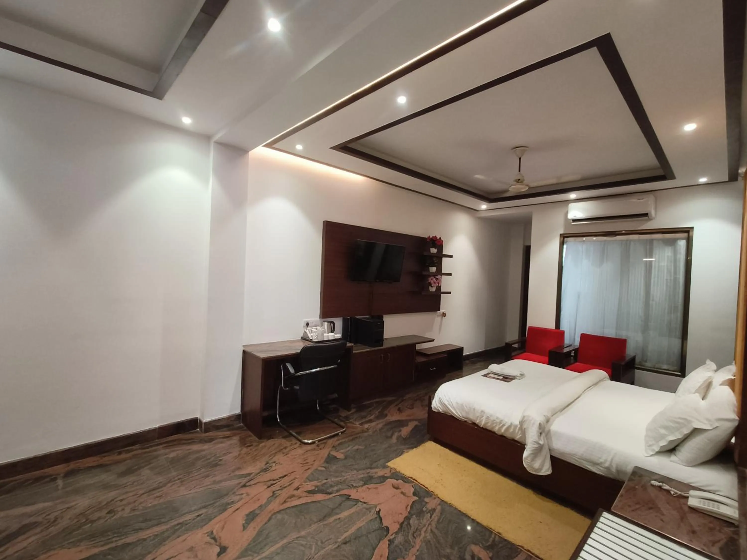 Bed in JJK Rukmini Vilas Hotel & Banquet