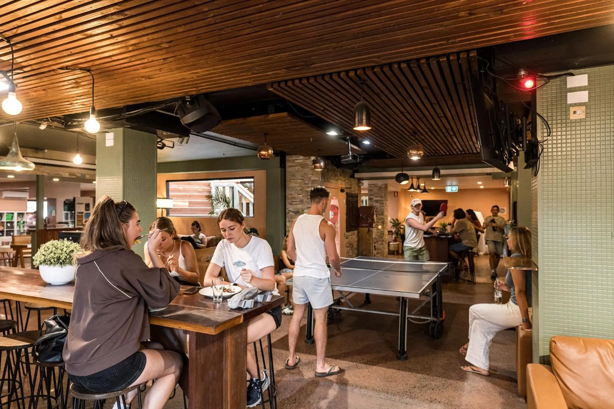 Communal lounge/ TV room in Aquarius Backpackers Resort