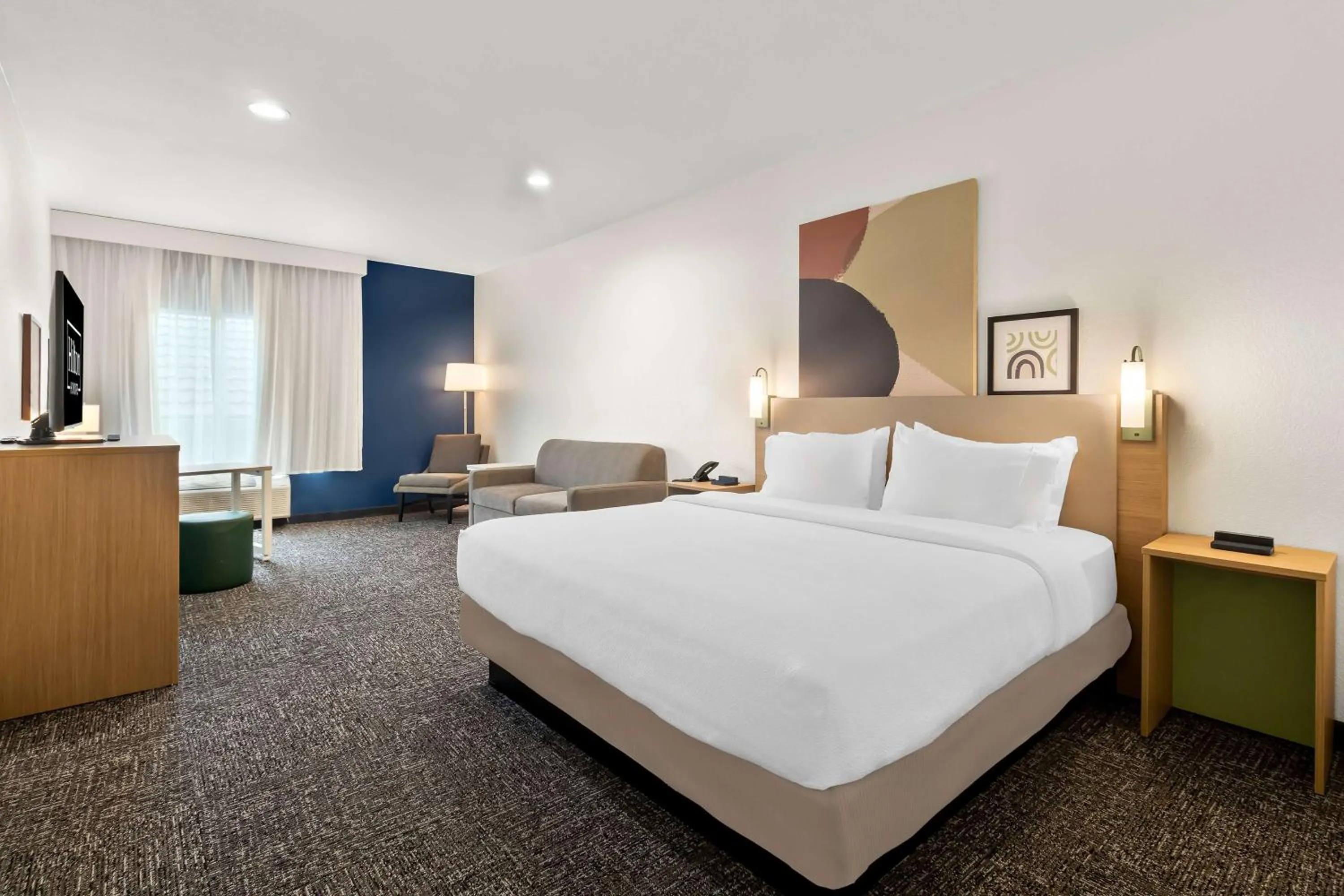 Living room, Bed in Spark By Hilton Missouri City