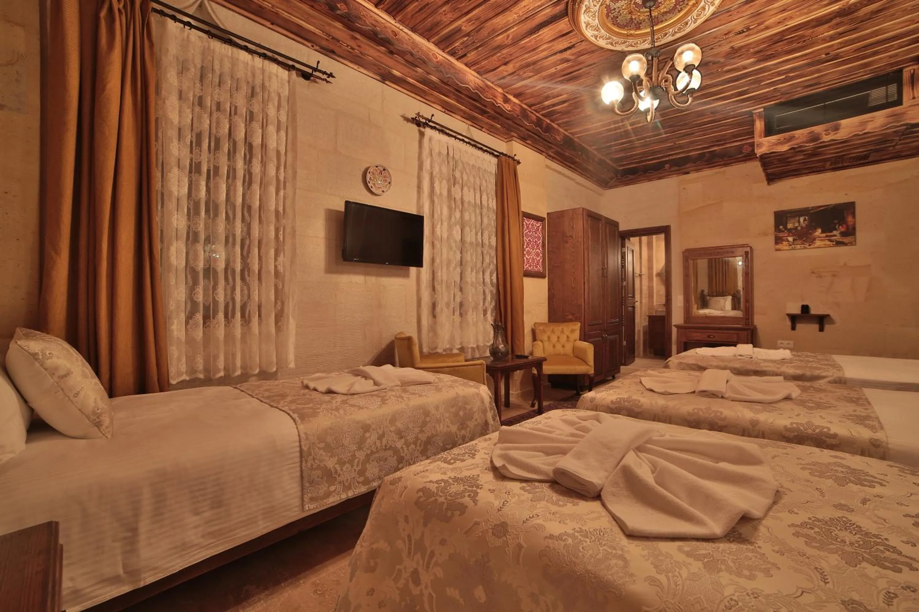 Bed in Caravanserai Inn Hotel