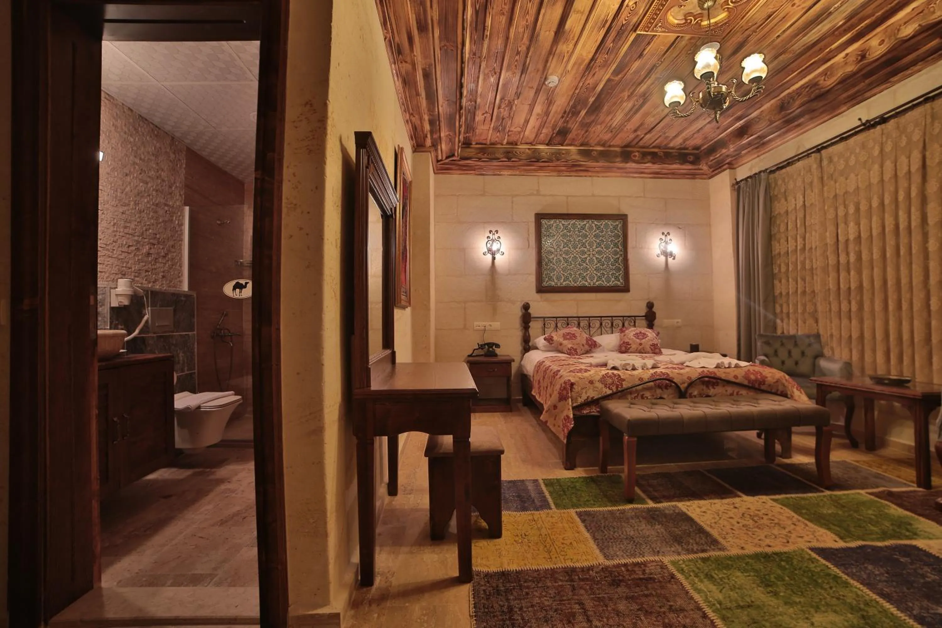 Bed in Caravanserai Inn Hotel