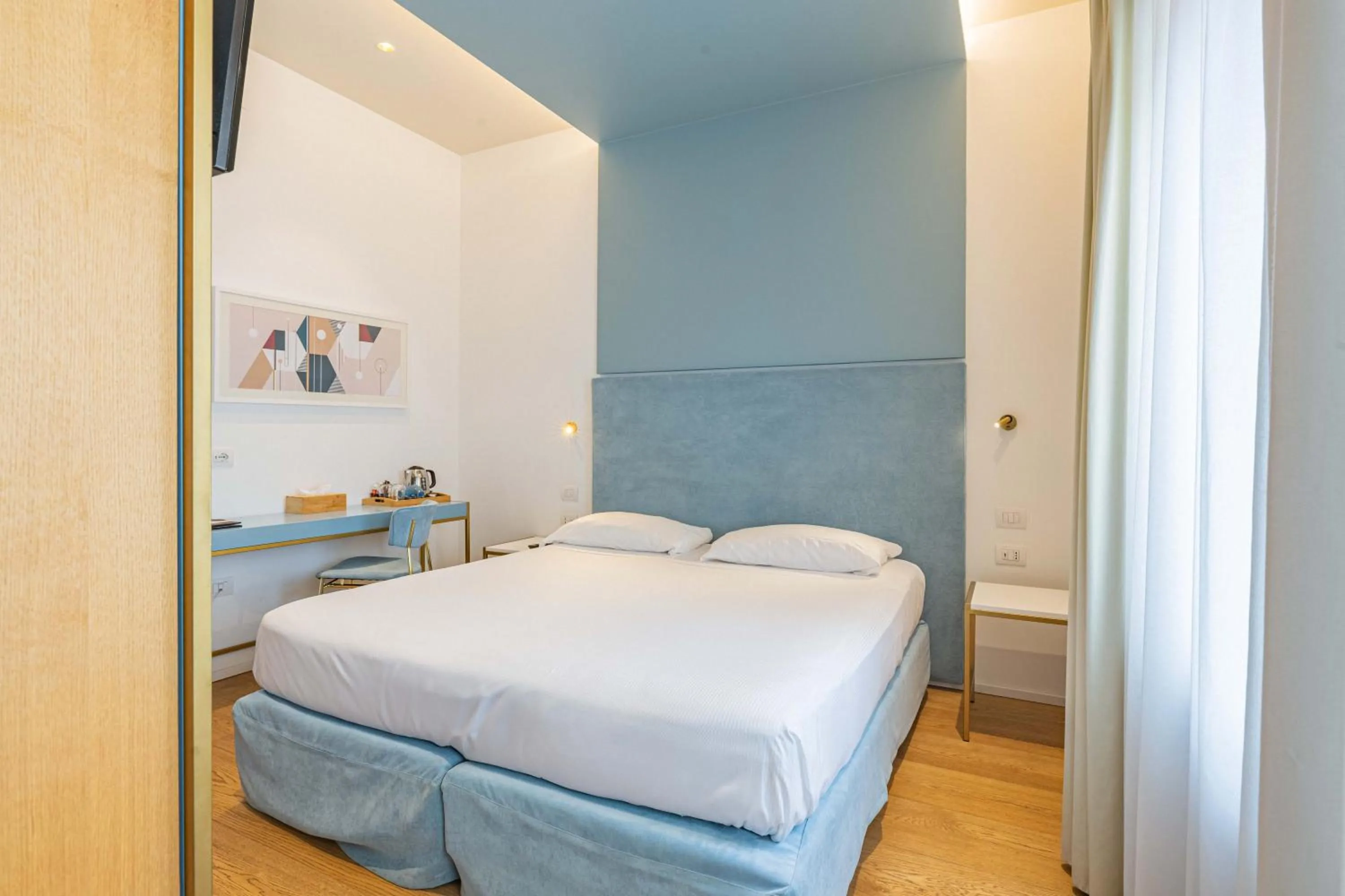 Bed in Hotel Aristeo