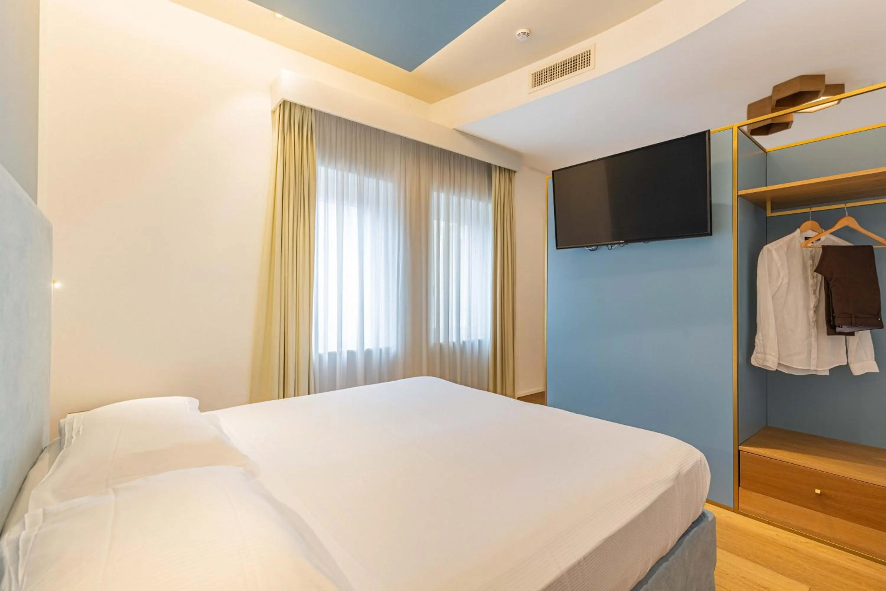 Bed in Hotel Aristeo