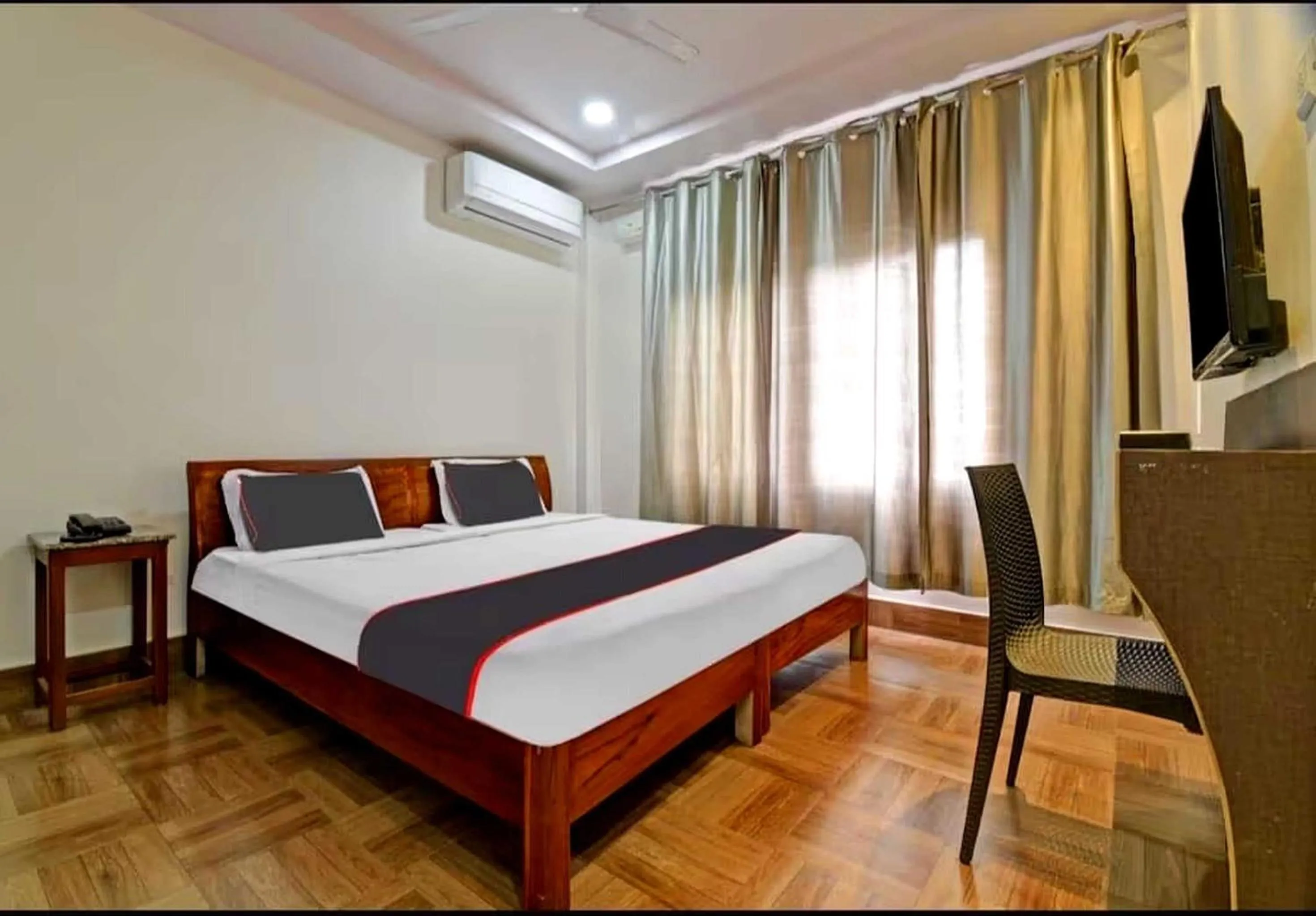 Bedroom in Collection O Megha Resort