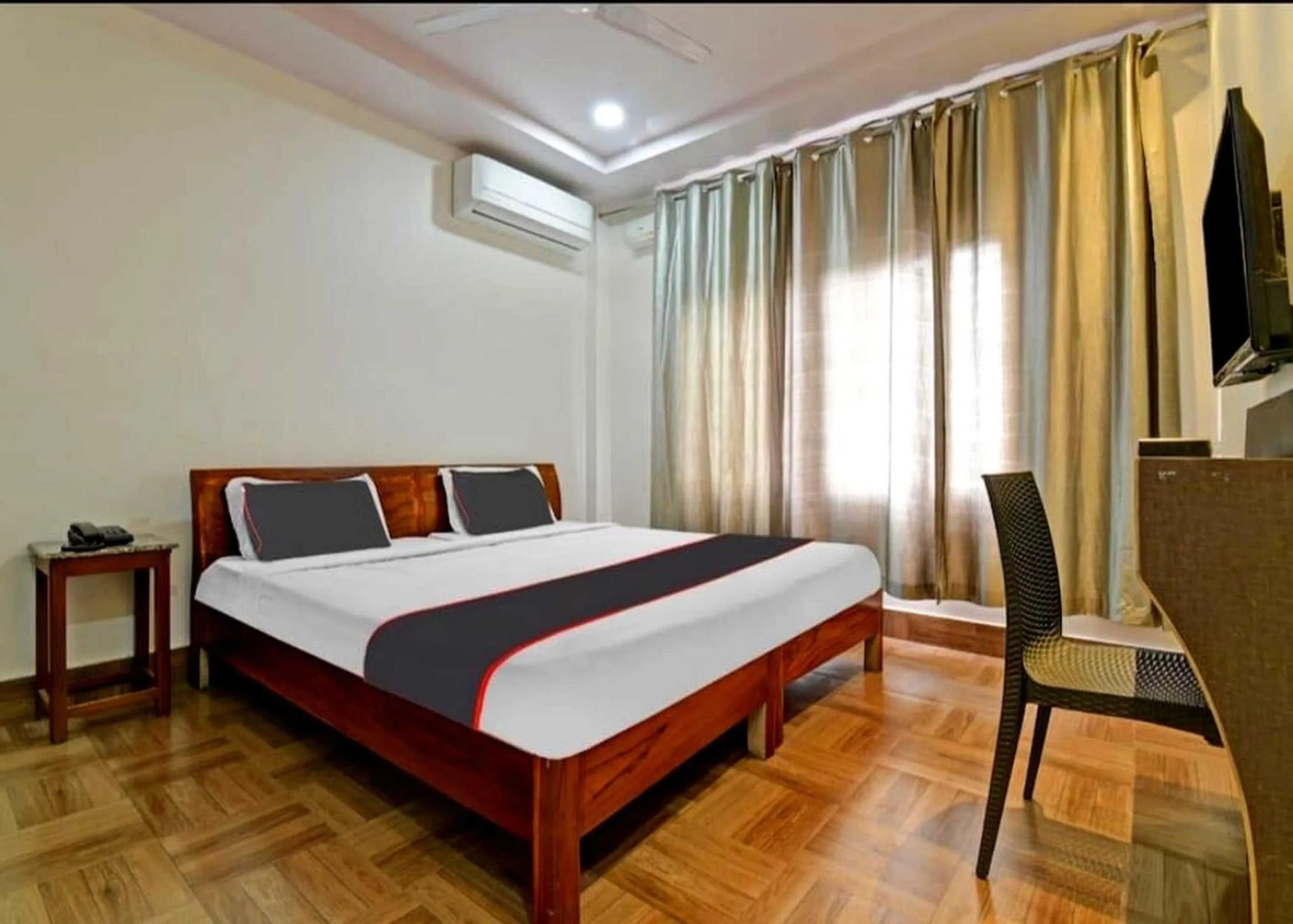 Bedroom in Collection O Megha Resort