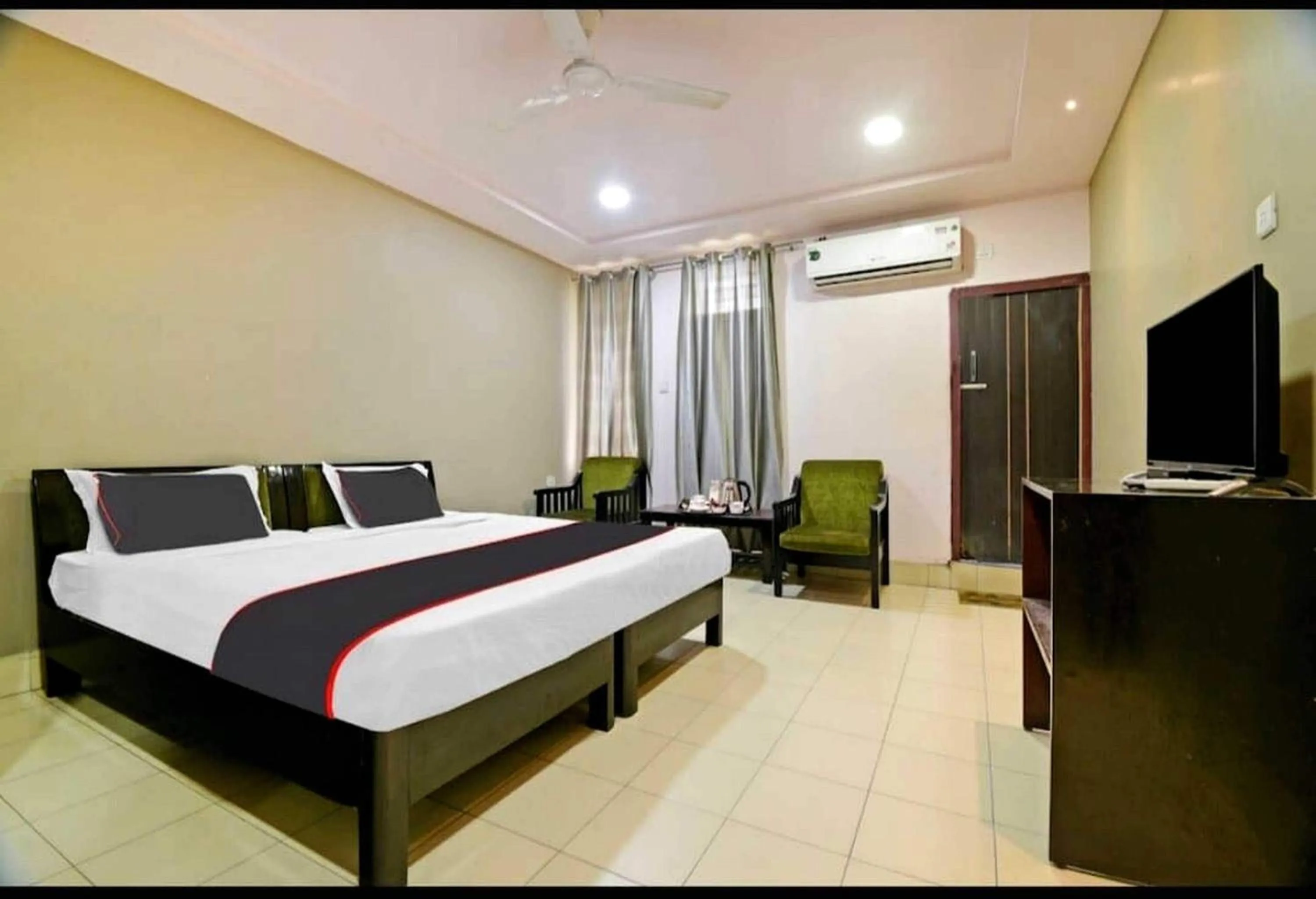 Bedroom in Collection O Megha Resort