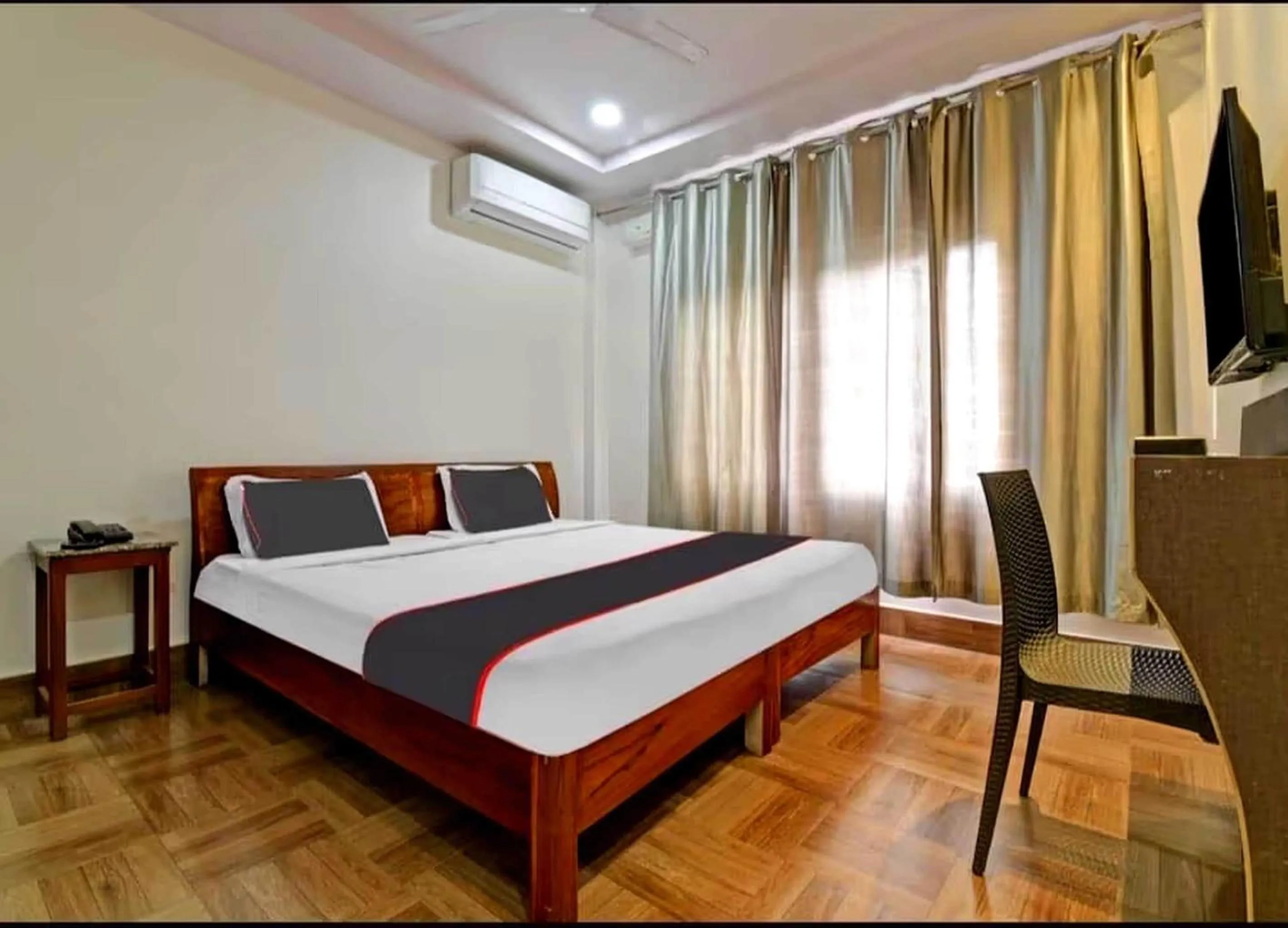 Bedroom in Collection O Megha Resort