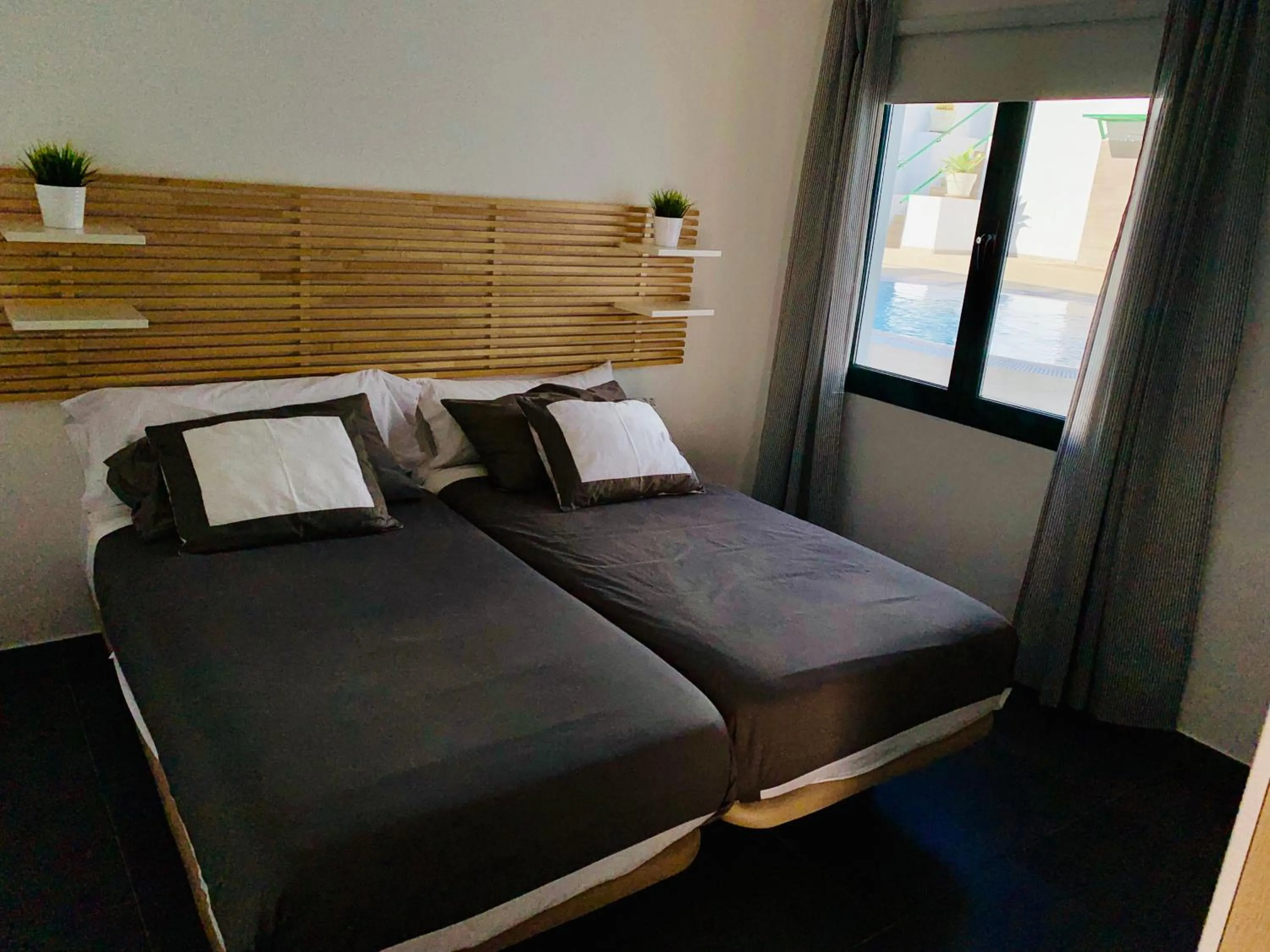 Bed in Apartamentos Zalabar