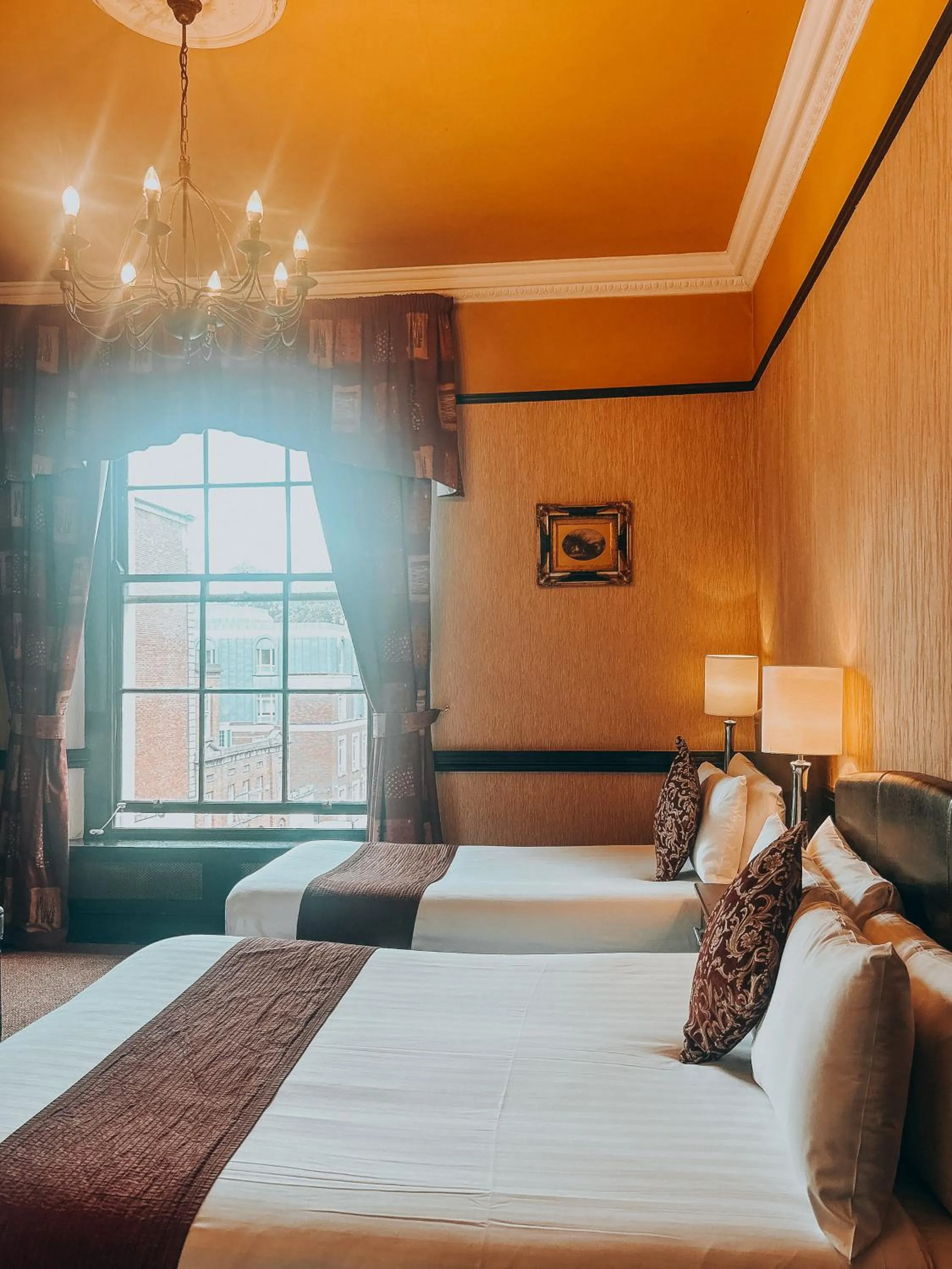 Bed in Russell Court Hotel