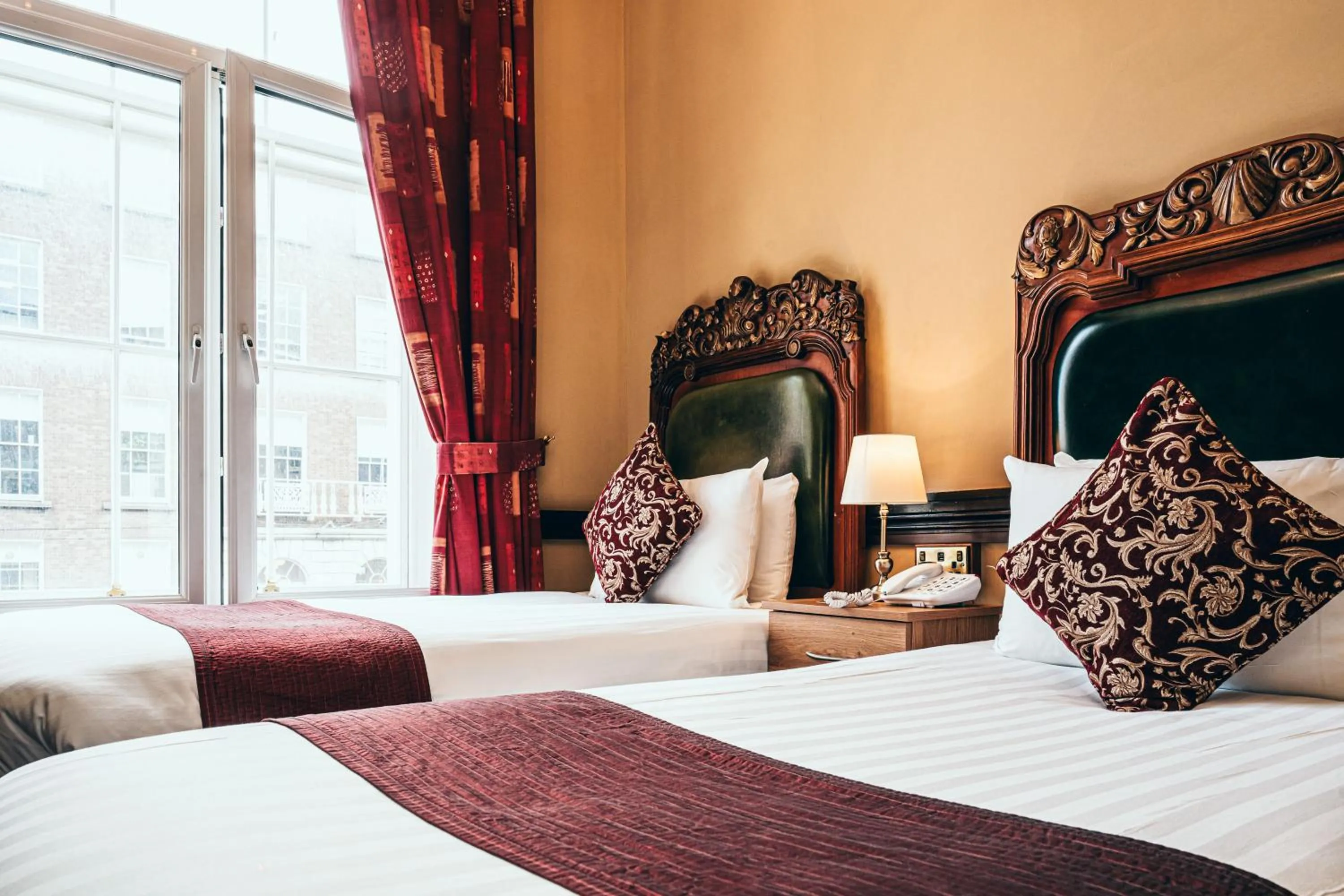 Bed in Russell Court Hotel