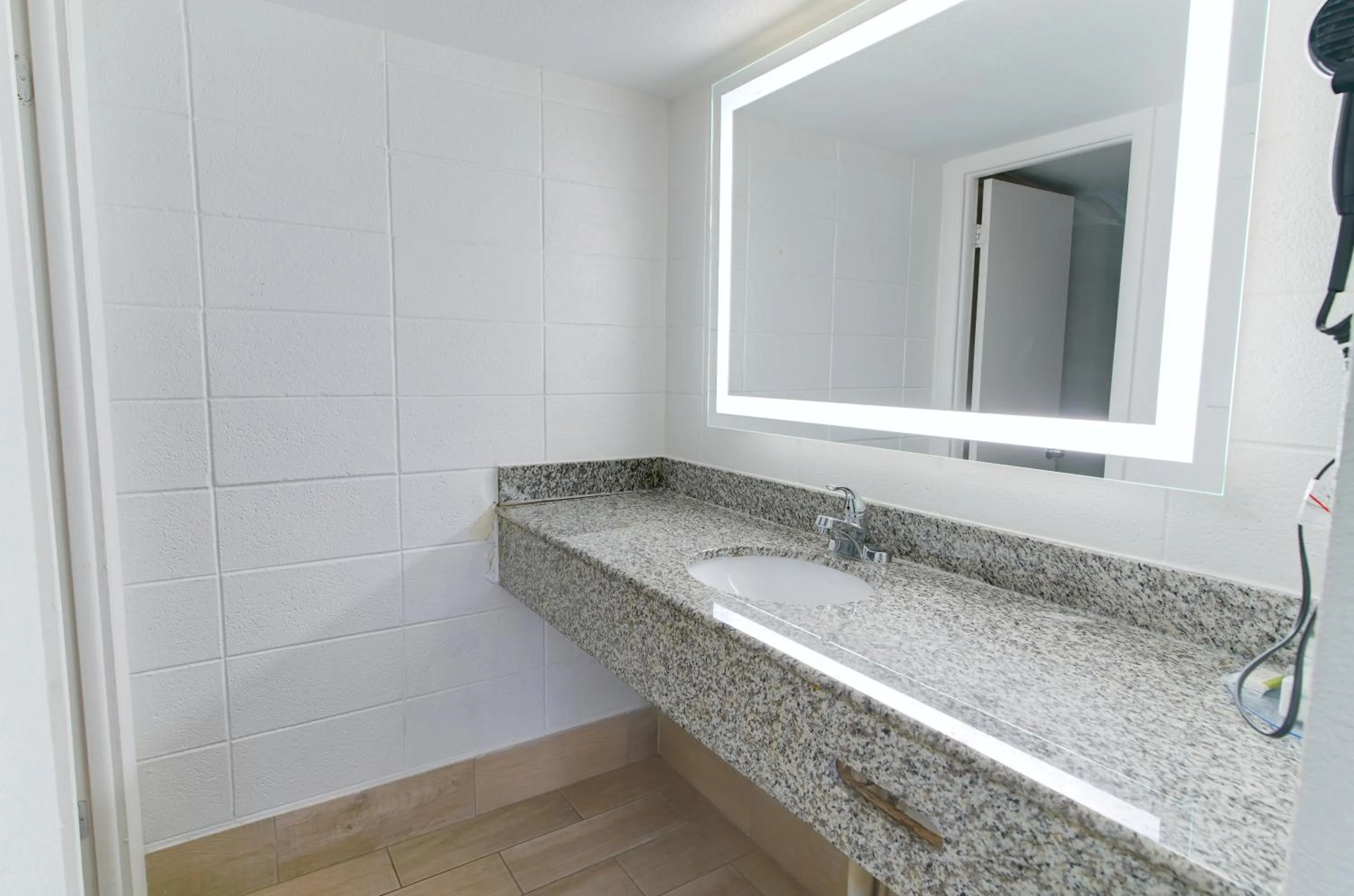 Bathroom in Howard Johnson by Wyndham Virginia Beach At The Beach