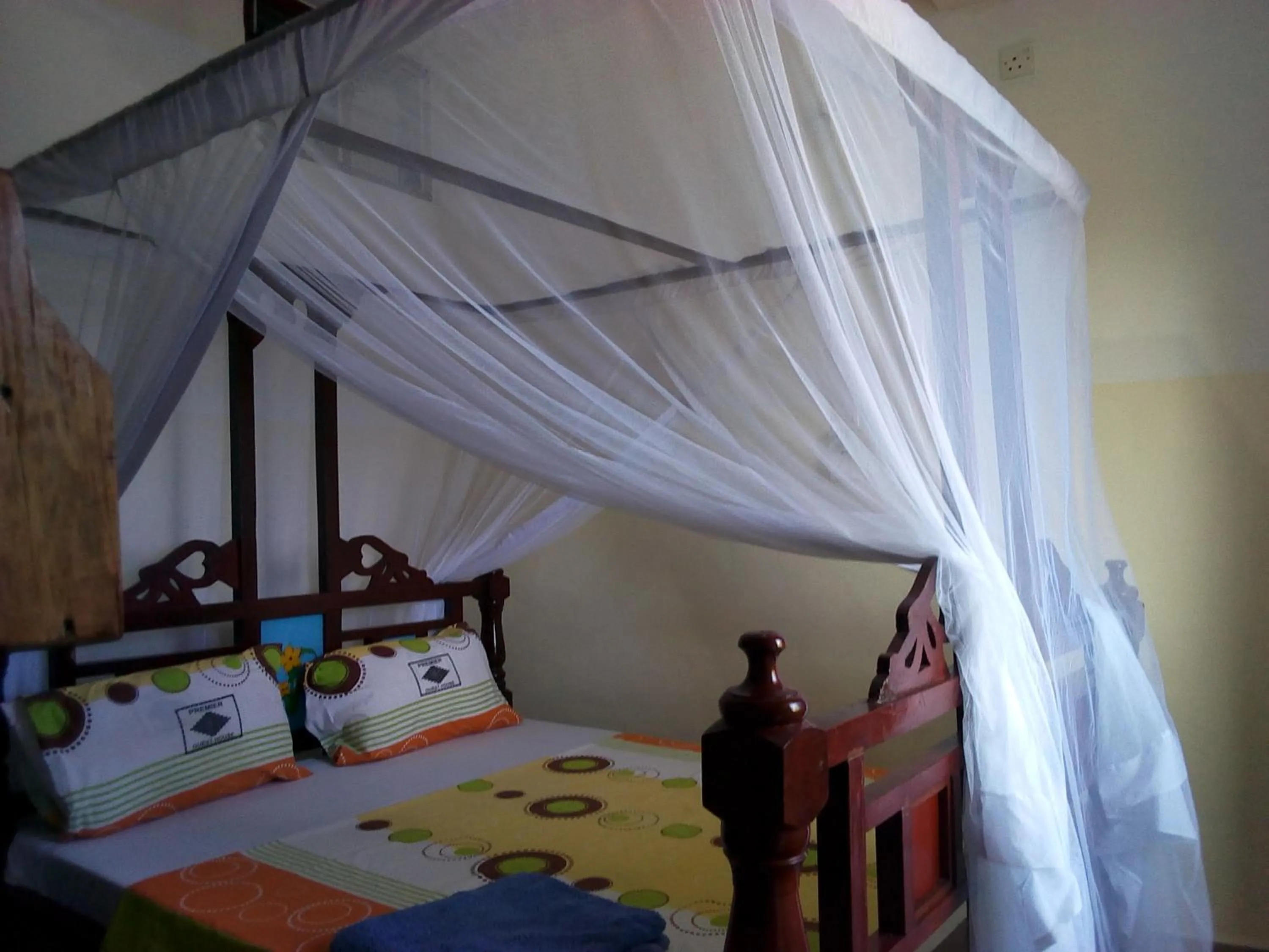 Bed in Premier Guest Residence Hotel