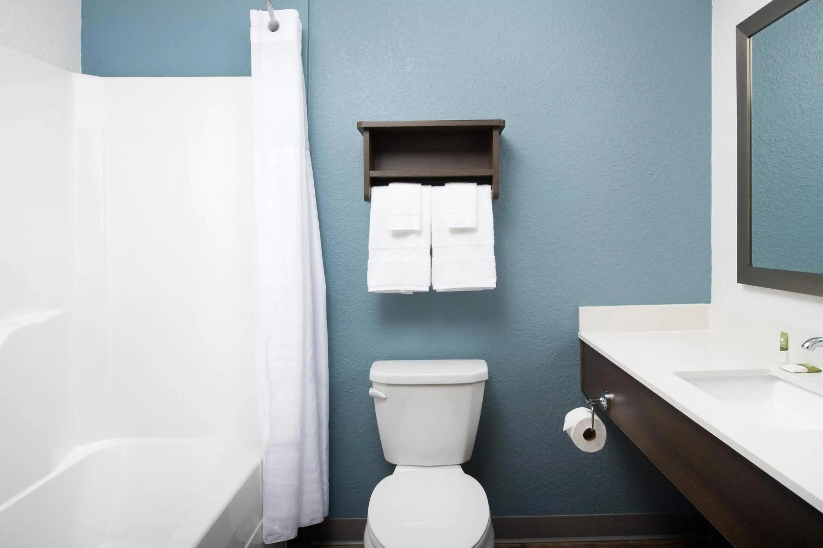 Bedroom in Woodspring Suites Orlando International Drive