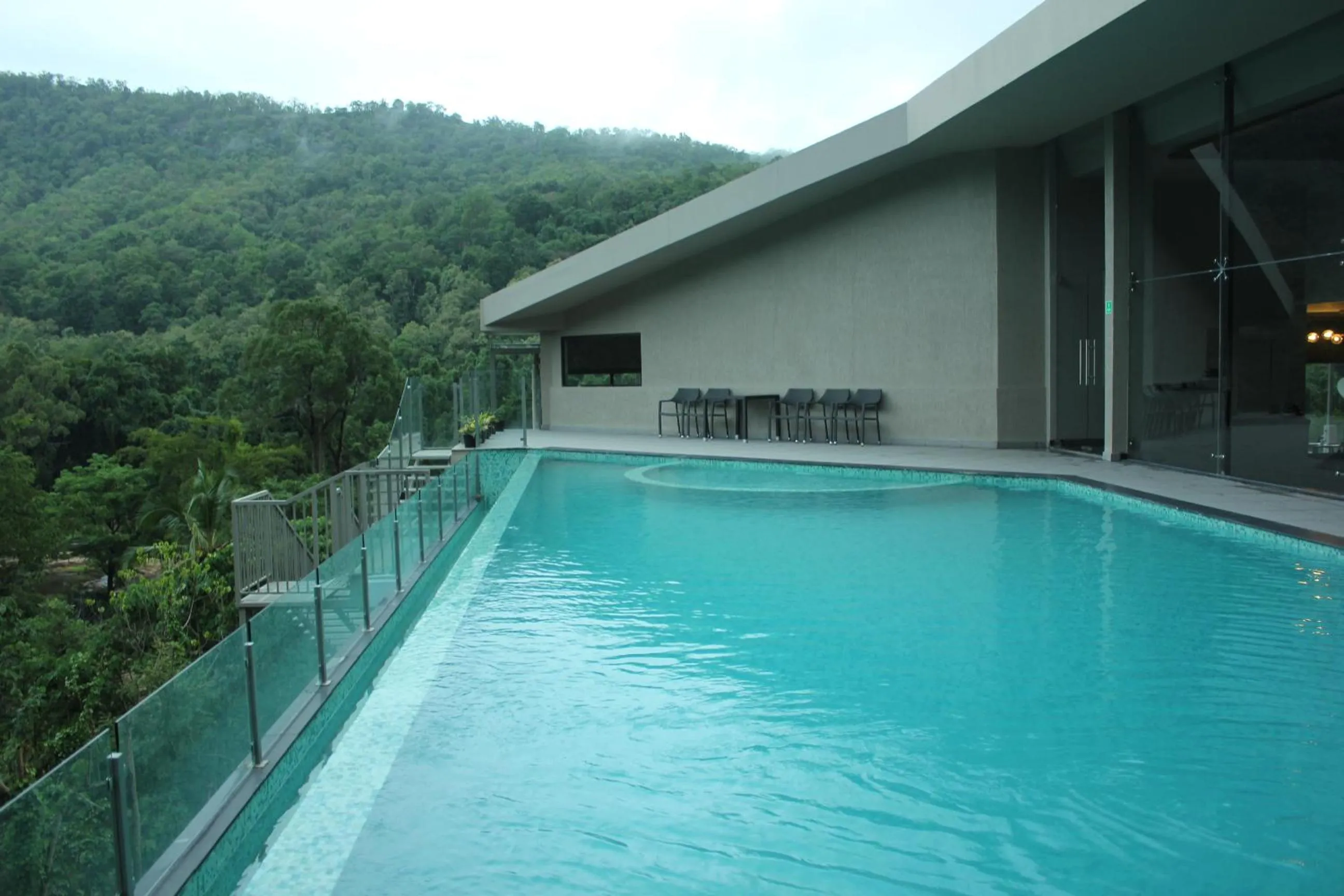 Swimming pool in Niraamaya Retreats Samroha Athirappilly