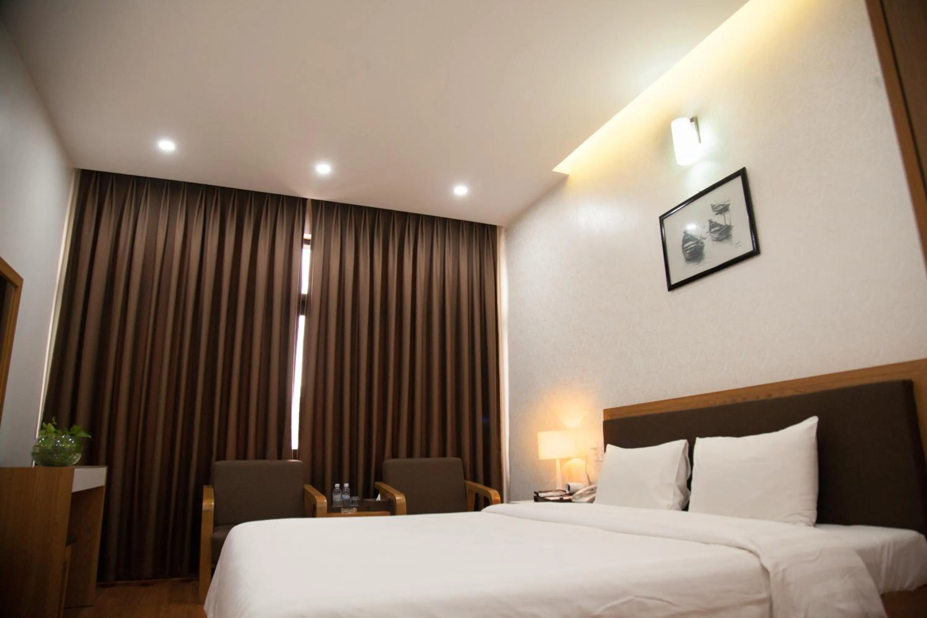 Bed in Bình Minh Hotel