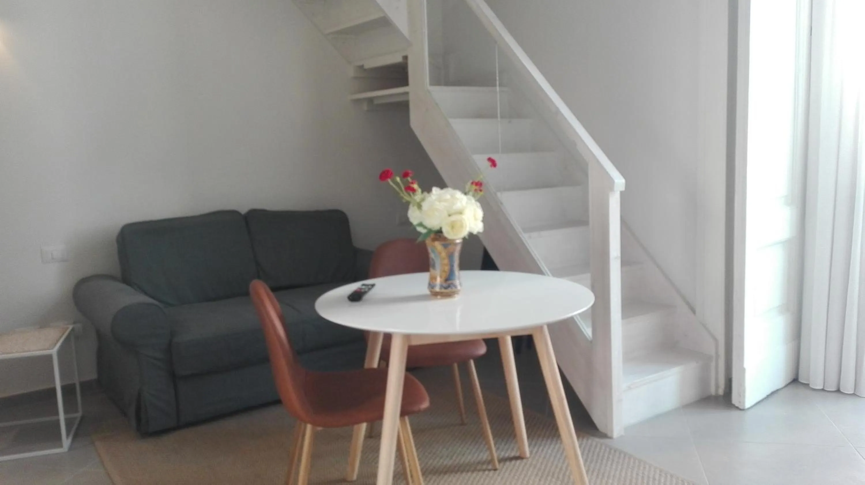 Seating area in Piano Nobile by Napoliapartments