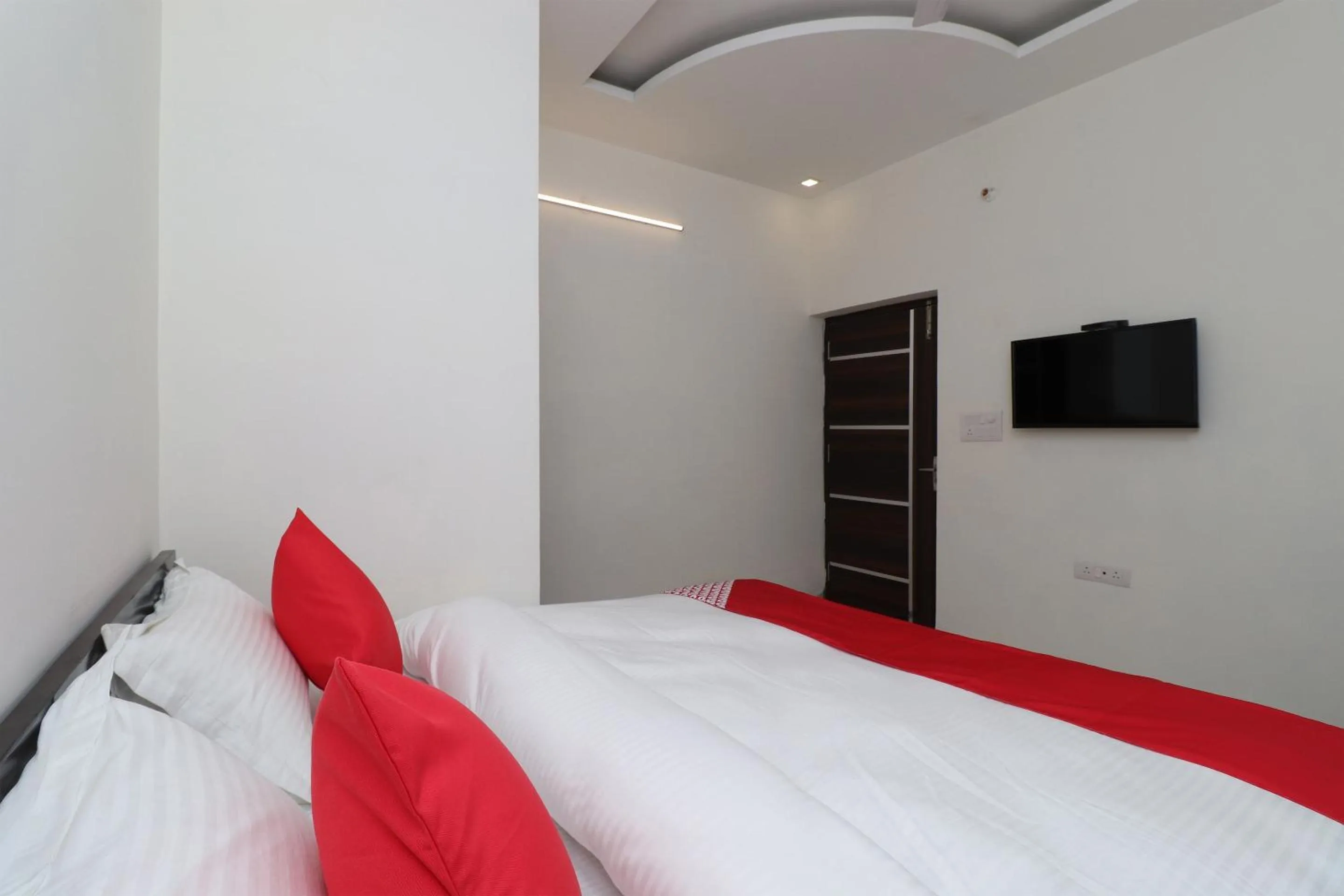 Bedroom in Hotel O Laxmi Residency