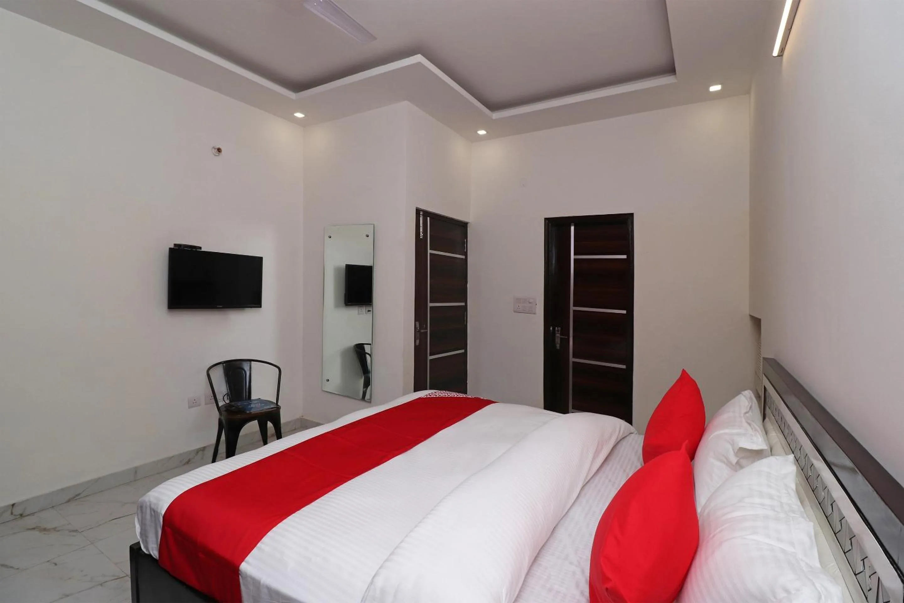 Bedroom in Hotel O Laxmi Residency