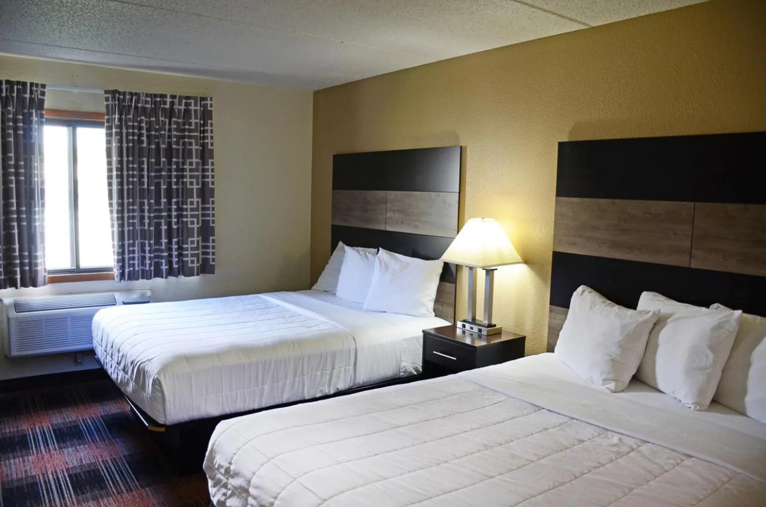 Bed in Baymont by Wyndham Waupun