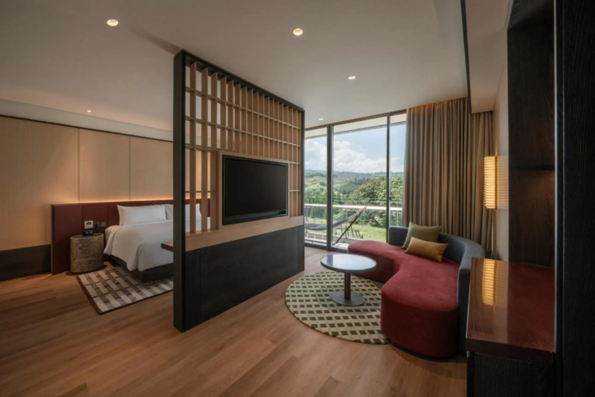 Living room, Bed in Hotel Neo+ Green Savana Sentul City