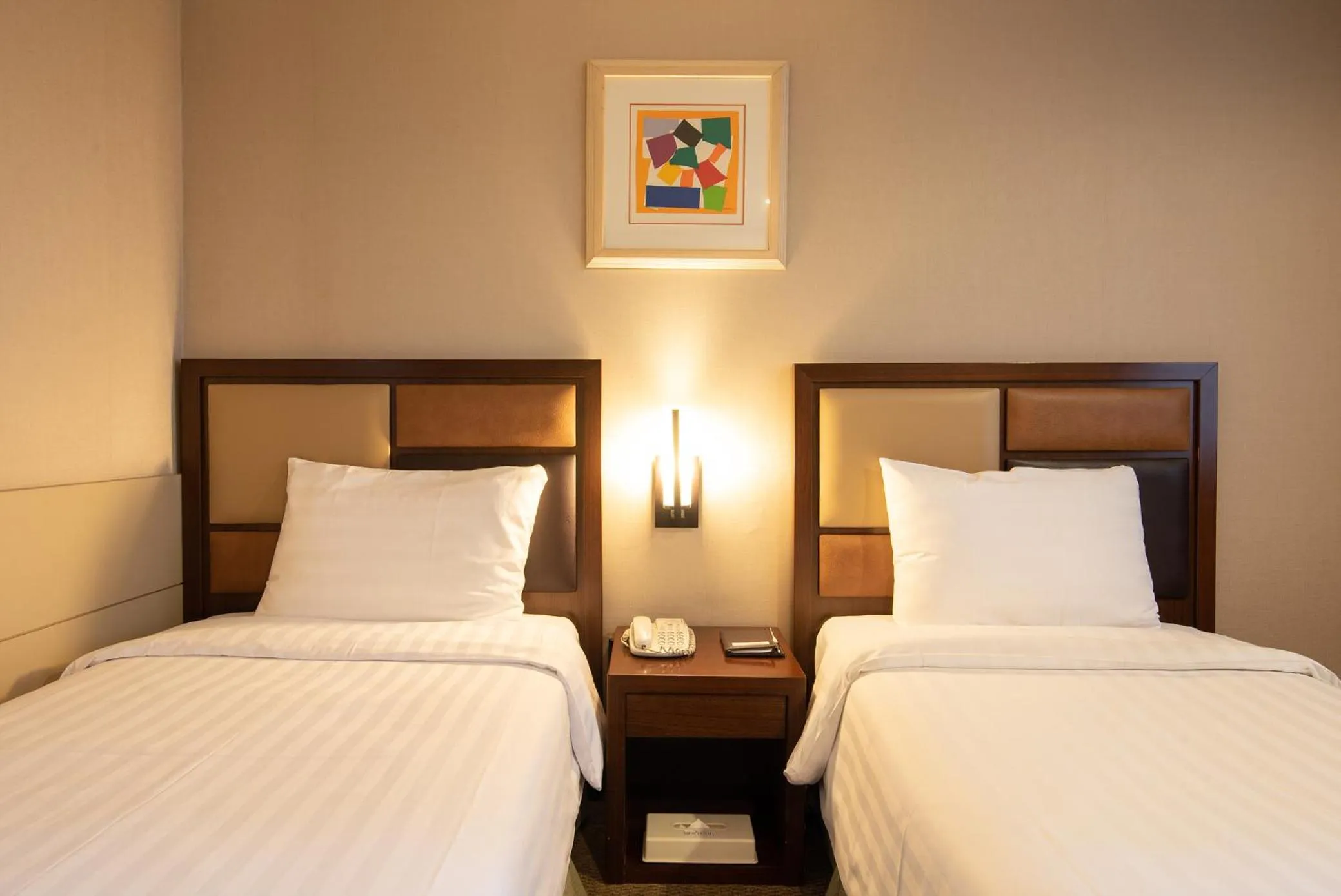 Bed in New Seoul Hotel Myeongdong