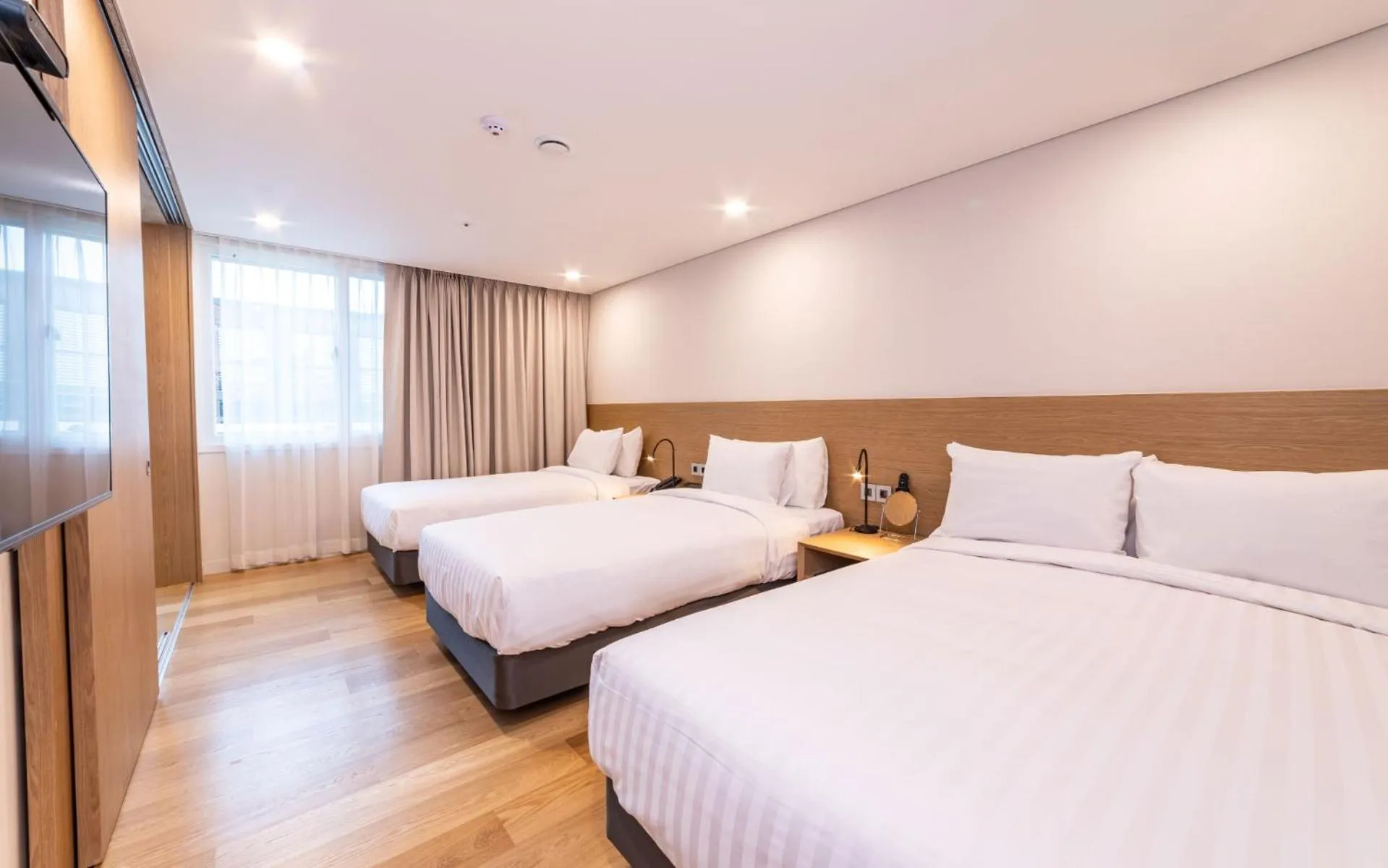 Bed in New Seoul Hotel Myeongdong