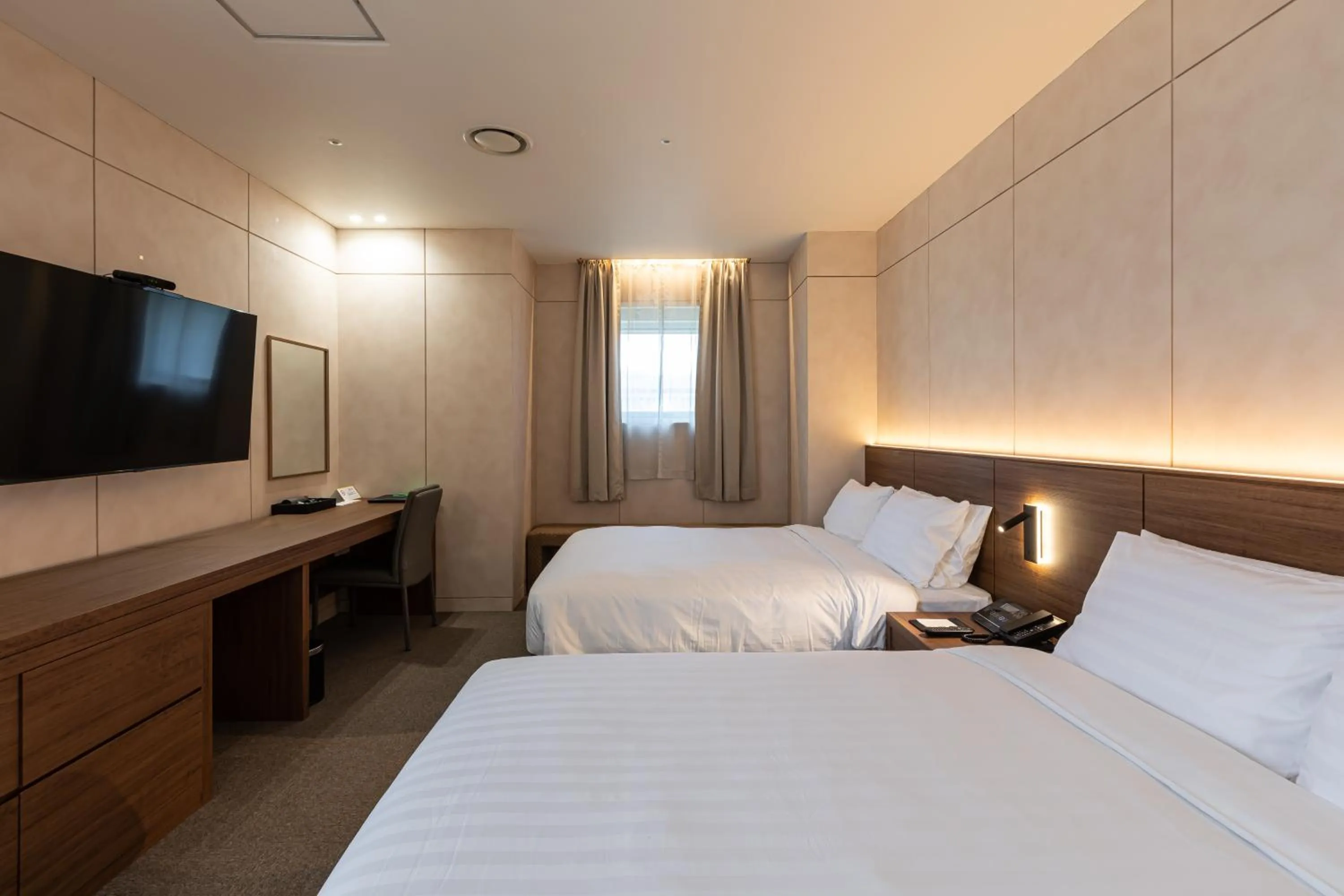 Bed in New Seoul Hotel Myeongdong