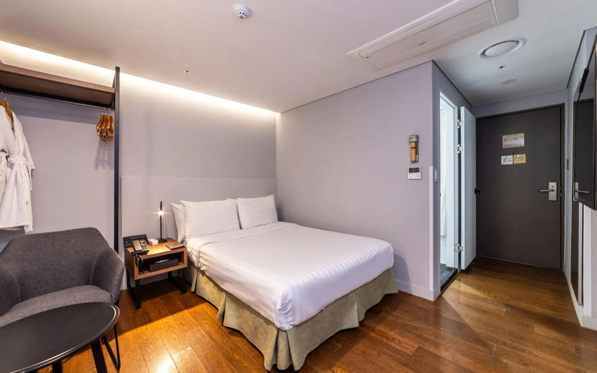 Bed in New Seoul Hotel Myeongdong