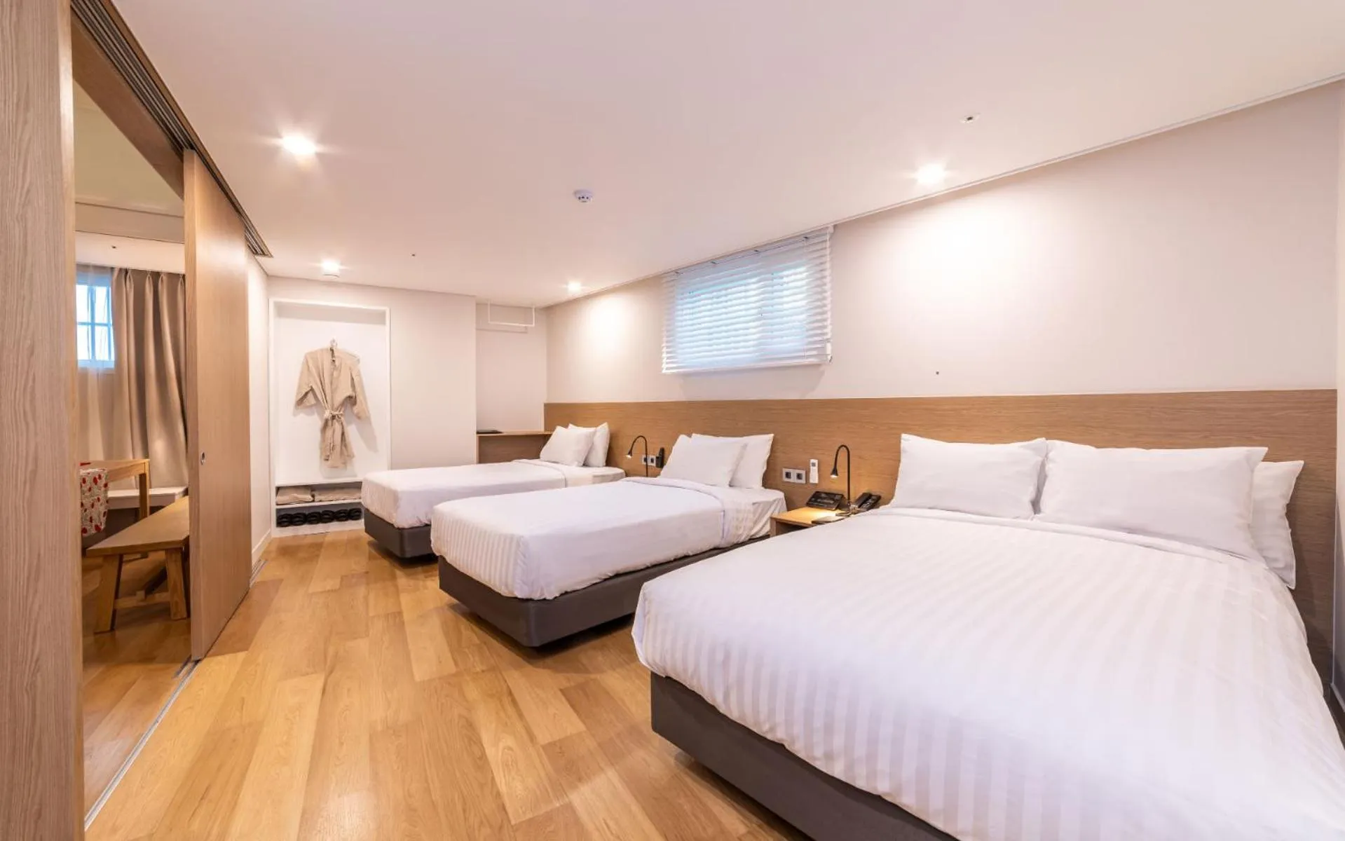 Bed in New Seoul Hotel Myeongdong