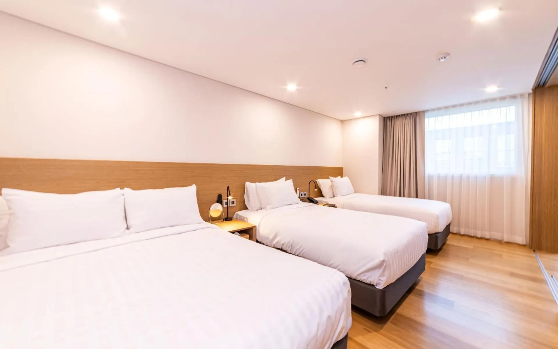 Bed in New Seoul Hotel Myeongdong