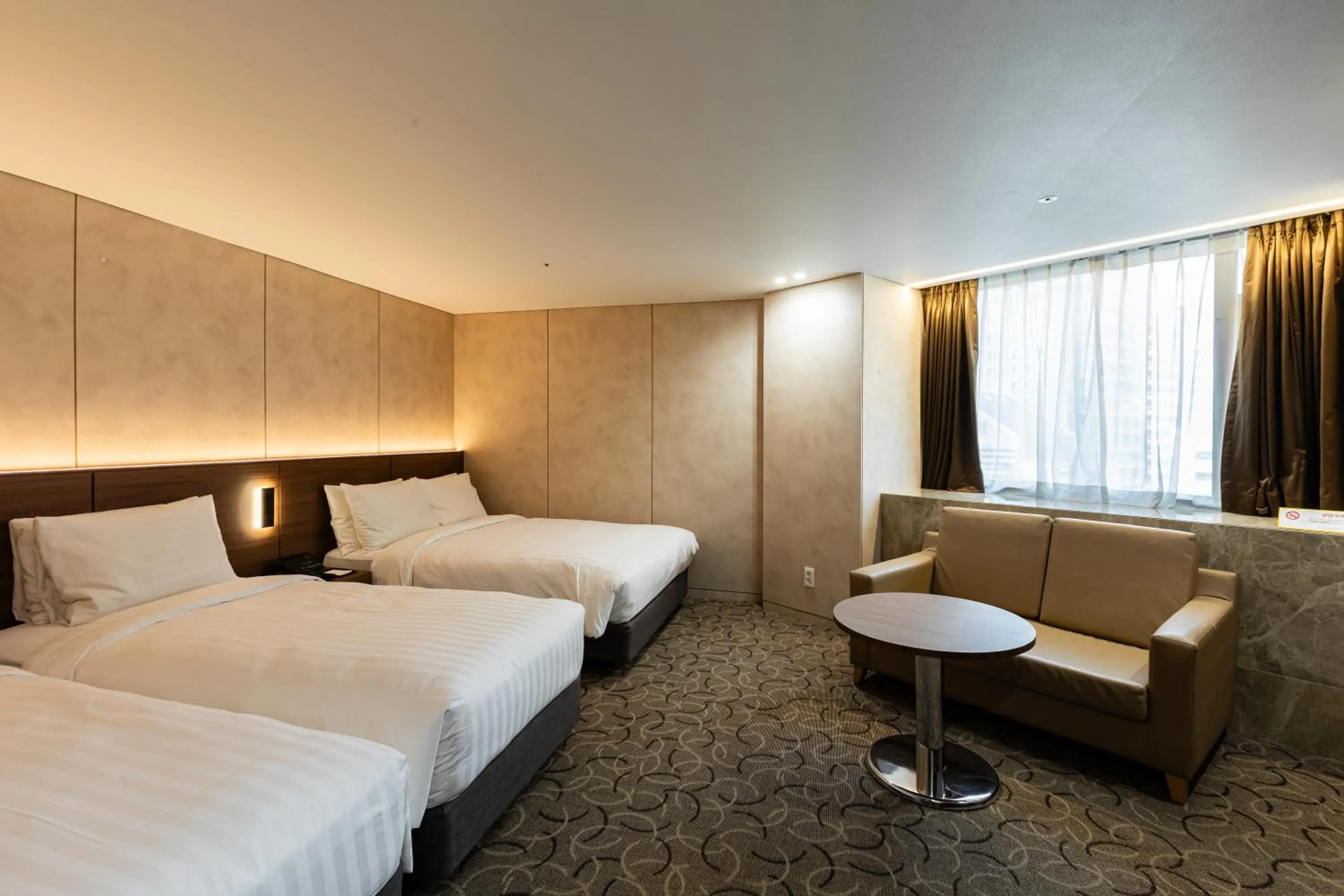 Bed in New Seoul Hotel Myeongdong