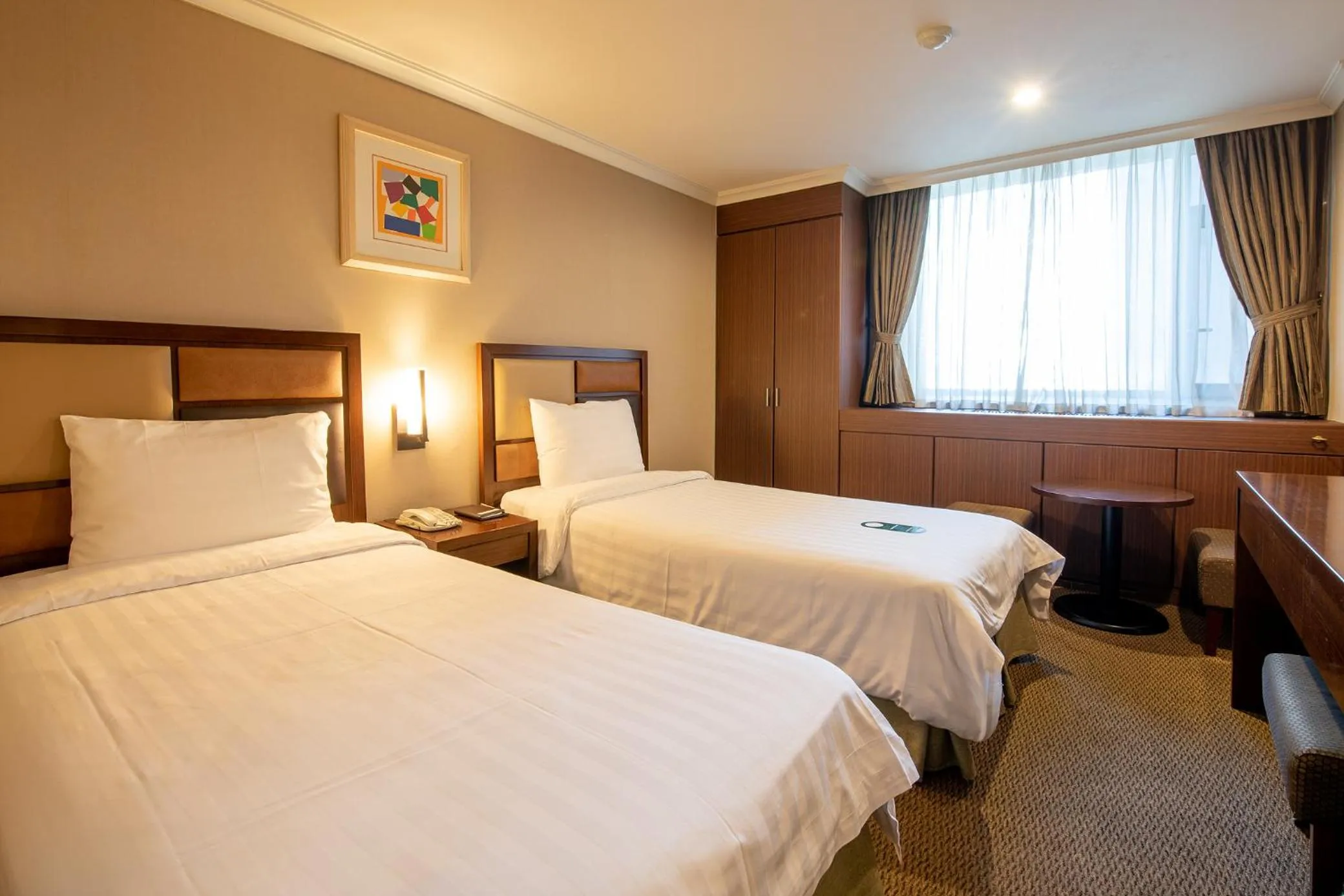 Bed in New Seoul Hotel Myeongdong