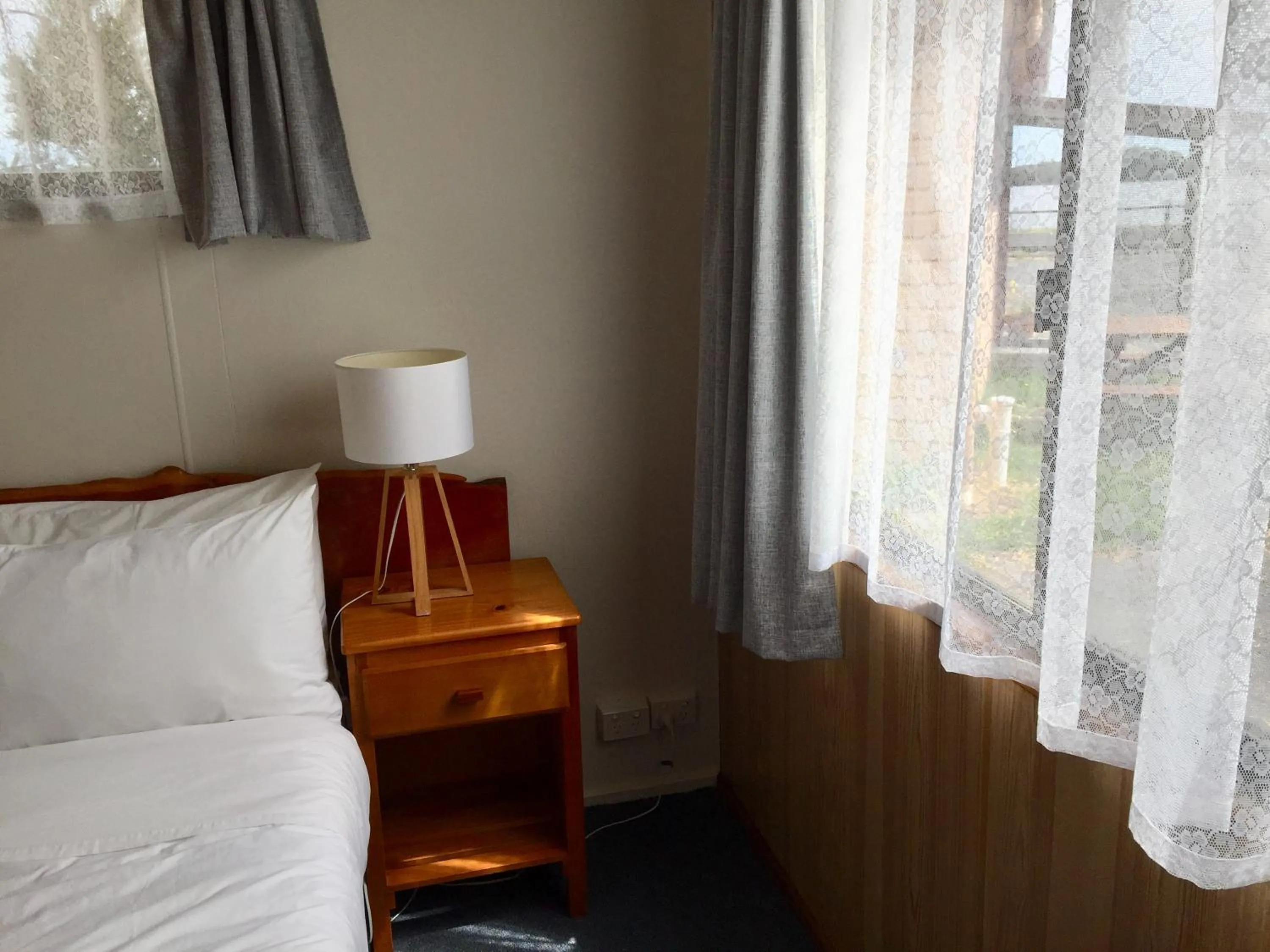 Bed in Regatta Point Tavern & Holiday Villas