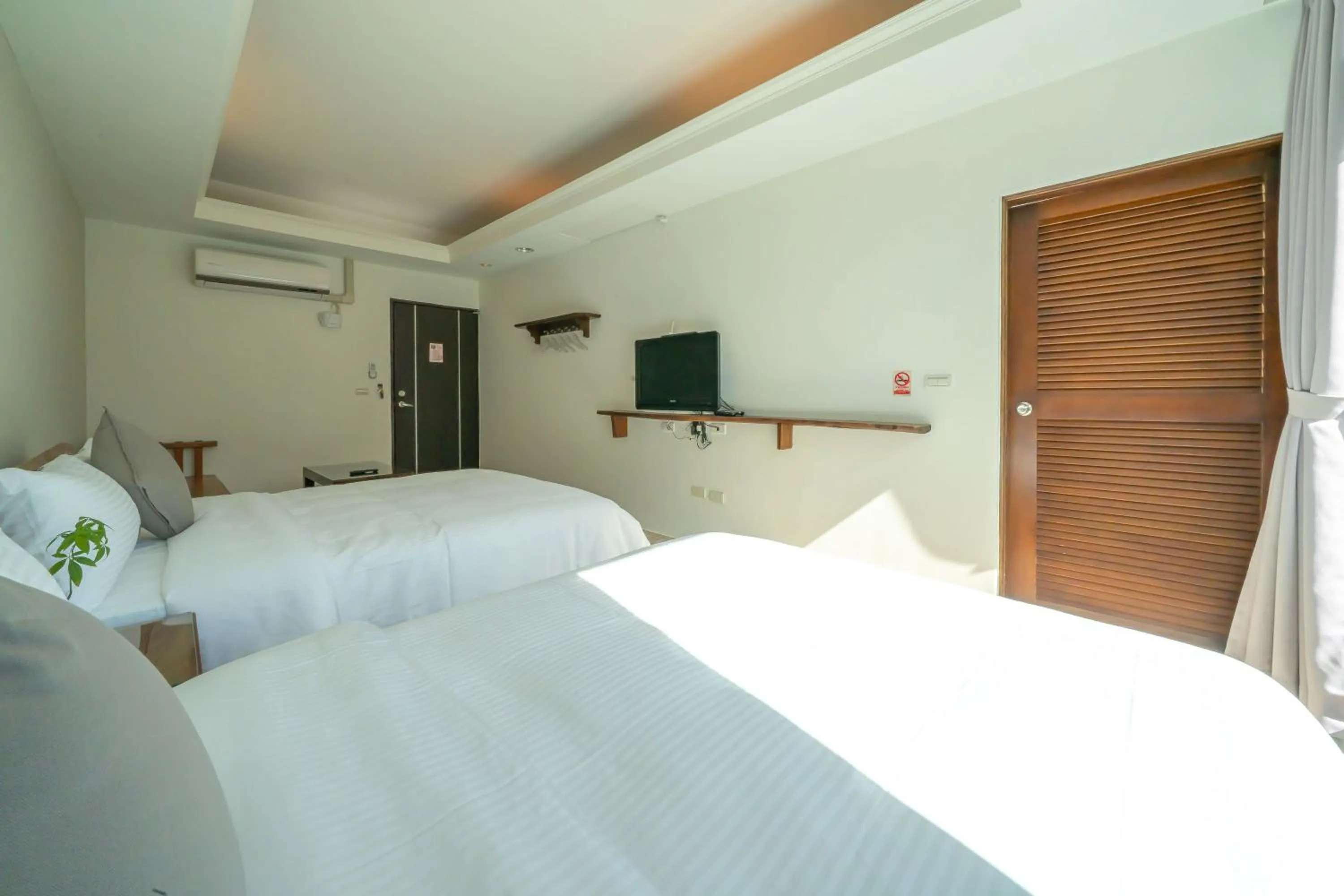 Bed in 美麗晨曦民宿-附停車位 近慈濟