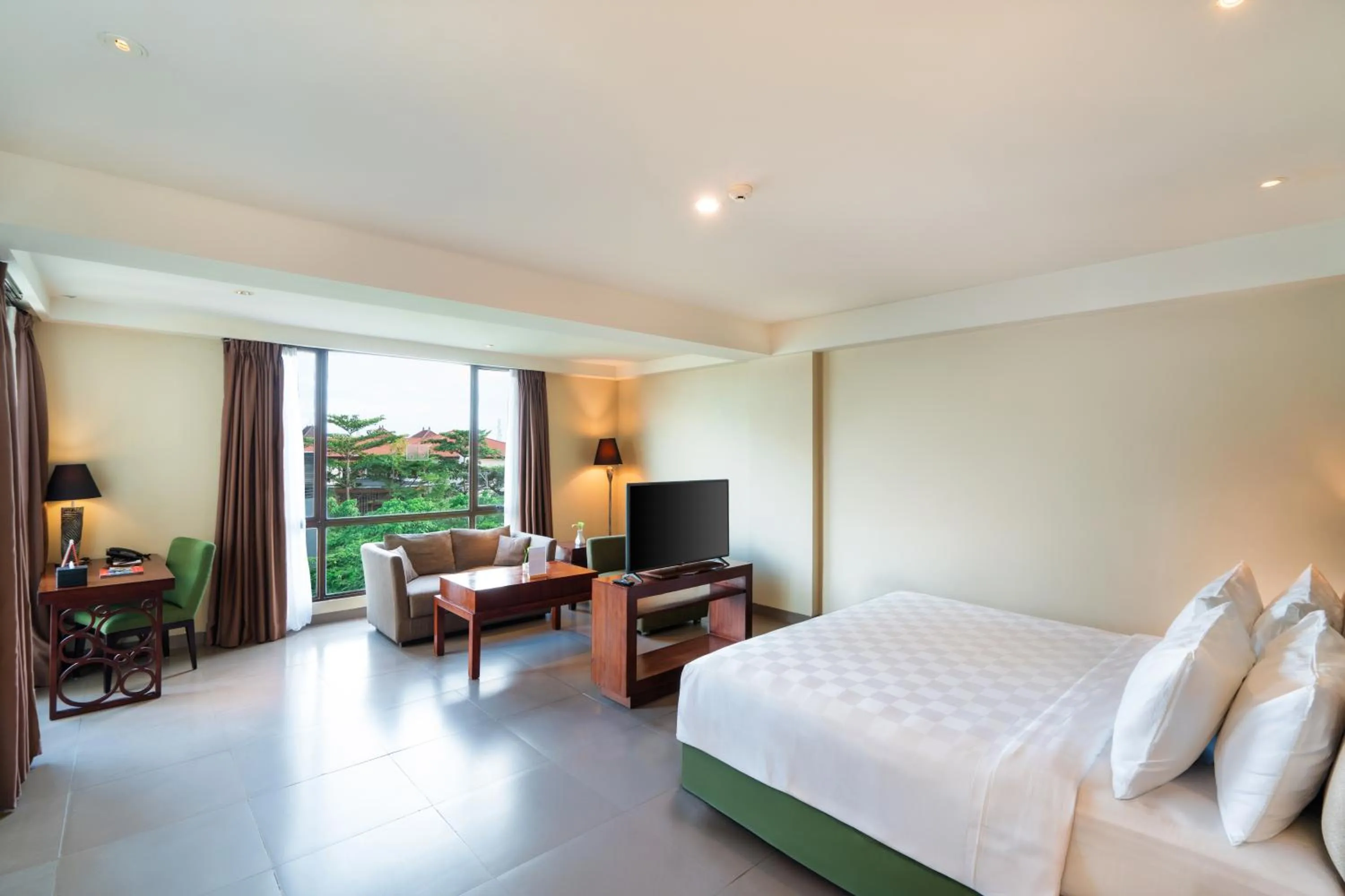 Bed in Swiss-Belhotel Rainforest