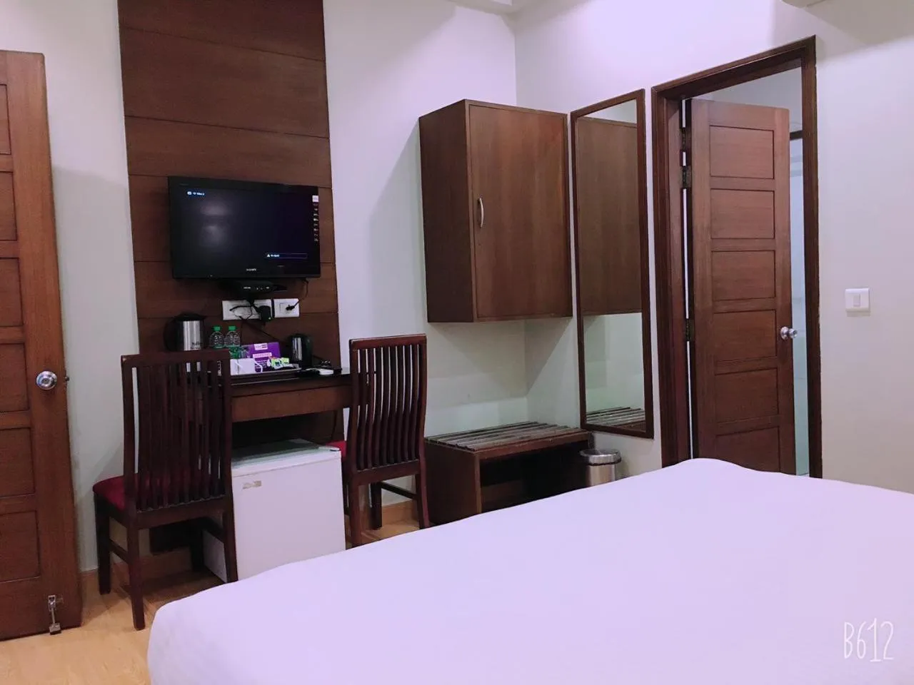 Communal lounge/ TV room, Bed in Hotel Dasaprakash