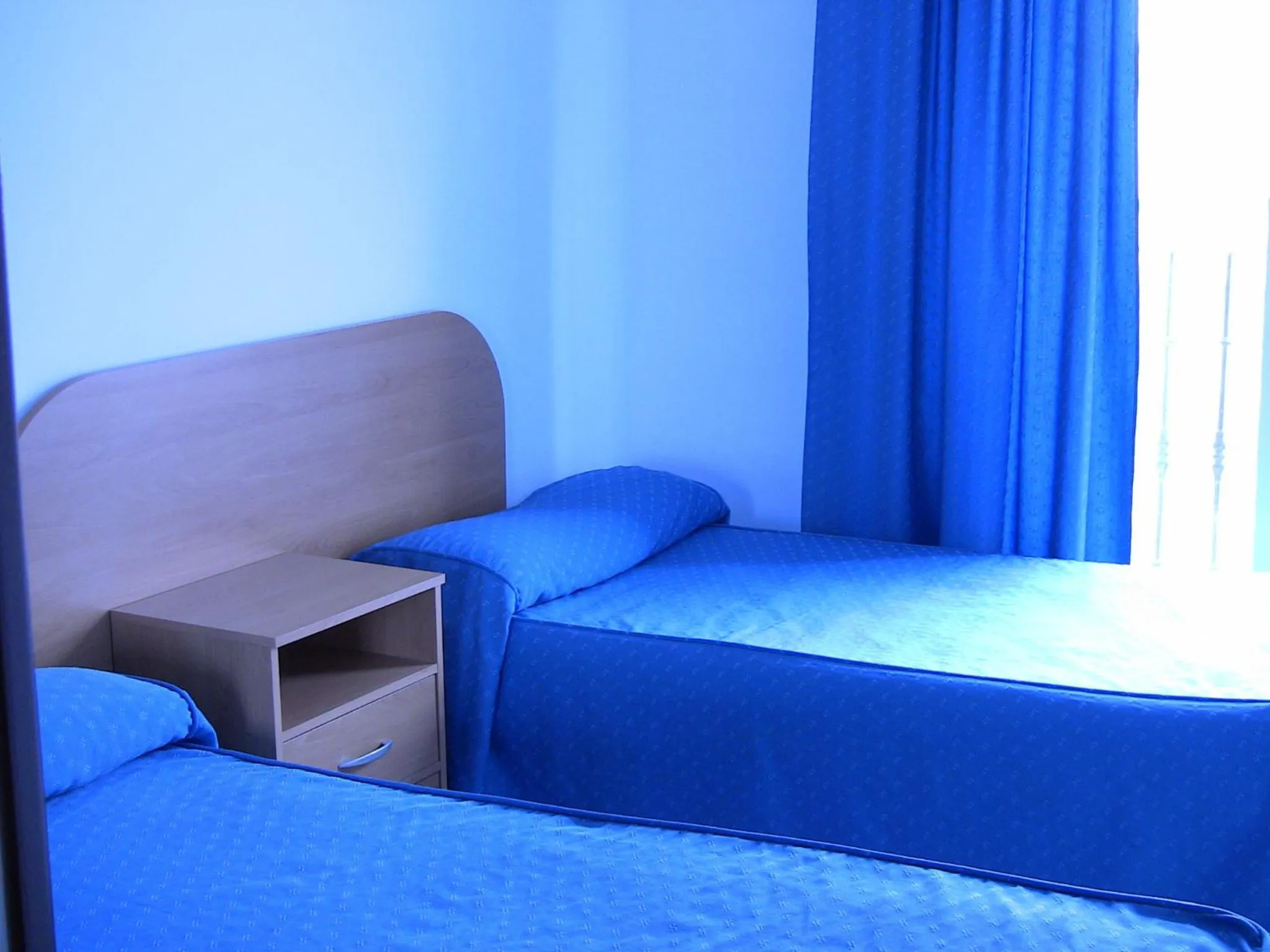 Bed in Apartahotel Los Hermanos