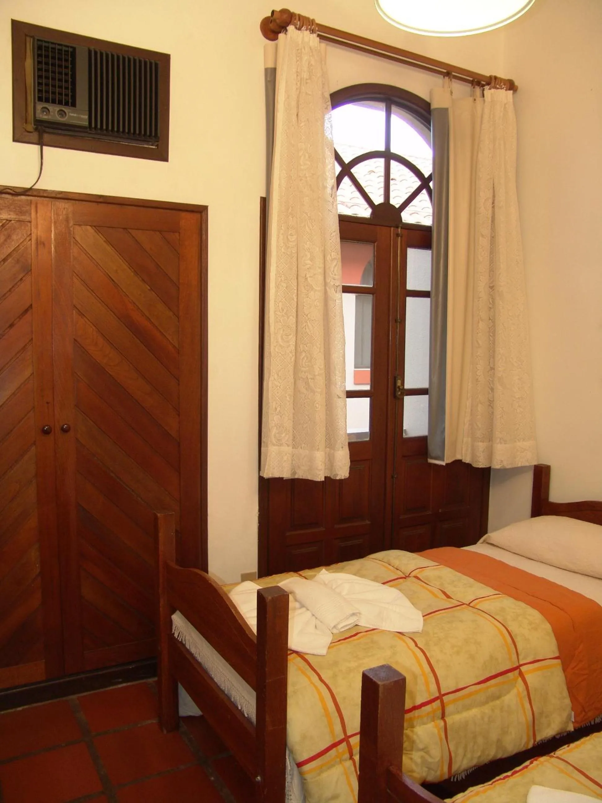 Bed in La Alhambra Apart Hotel