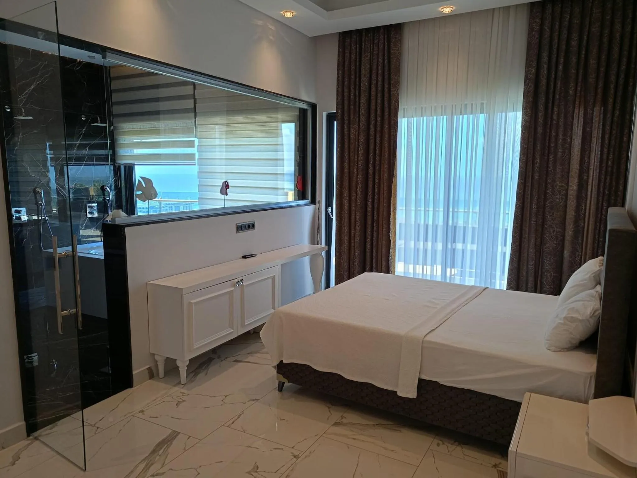 Bed in Elite Luxury Suite & Spa