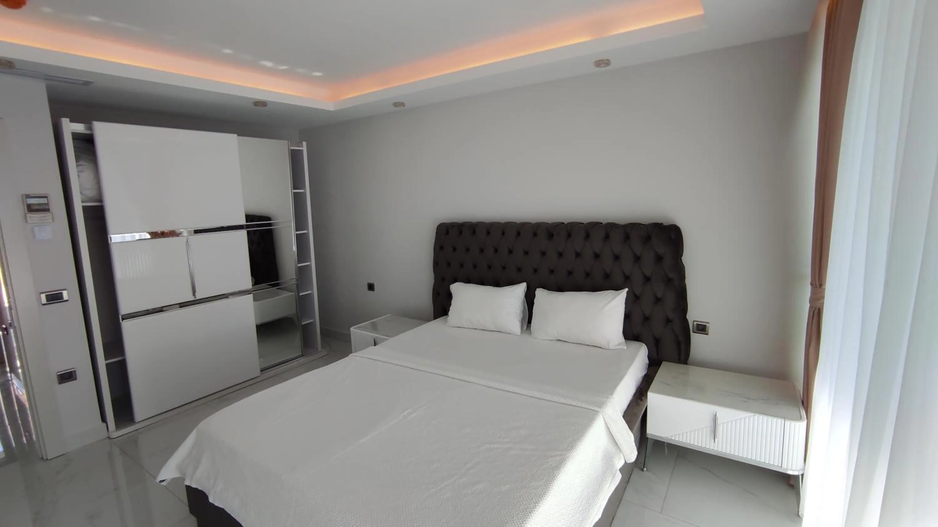 Bed in Elite Luxury Suite & Spa