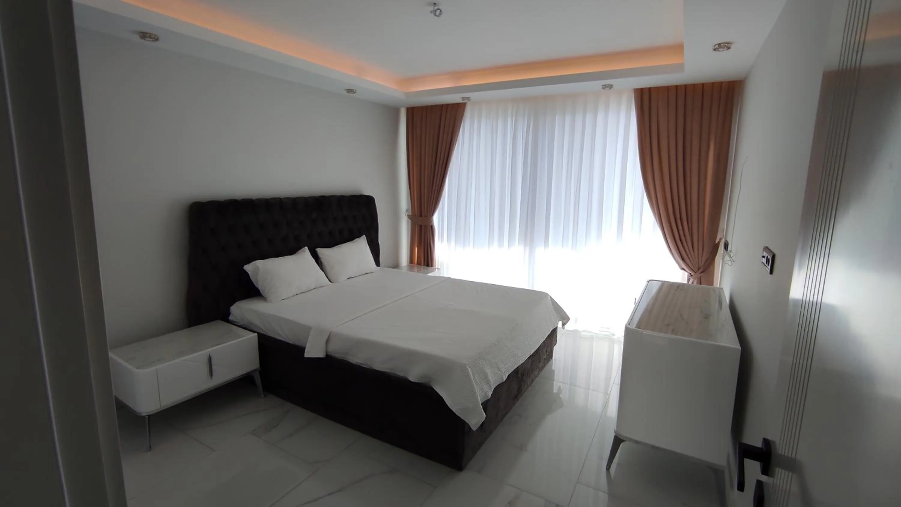 Bed in Elite Luxury Suite & Spa