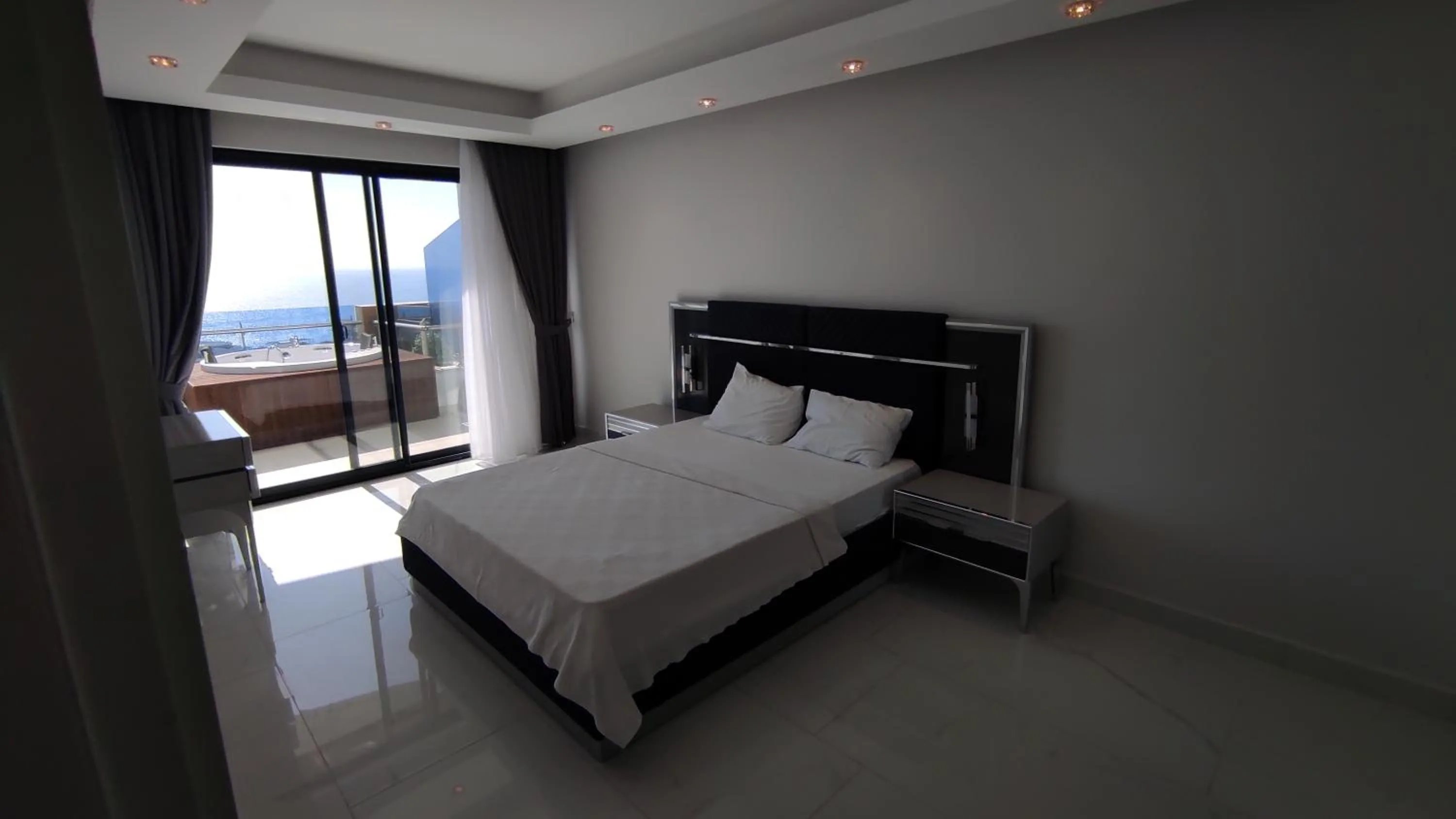 Bed in Elite Luxury Suite & Spa