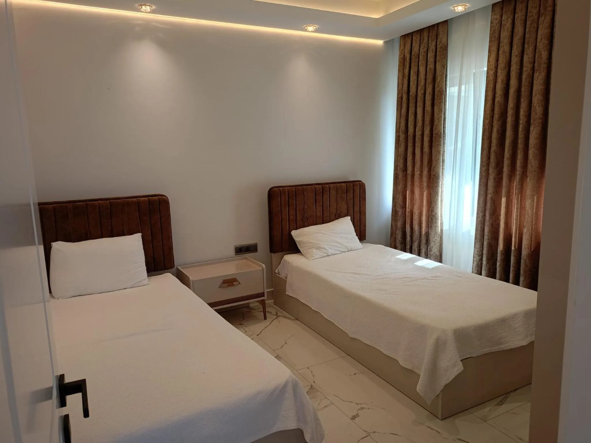 Bed in Elite Luxury Suite & Spa